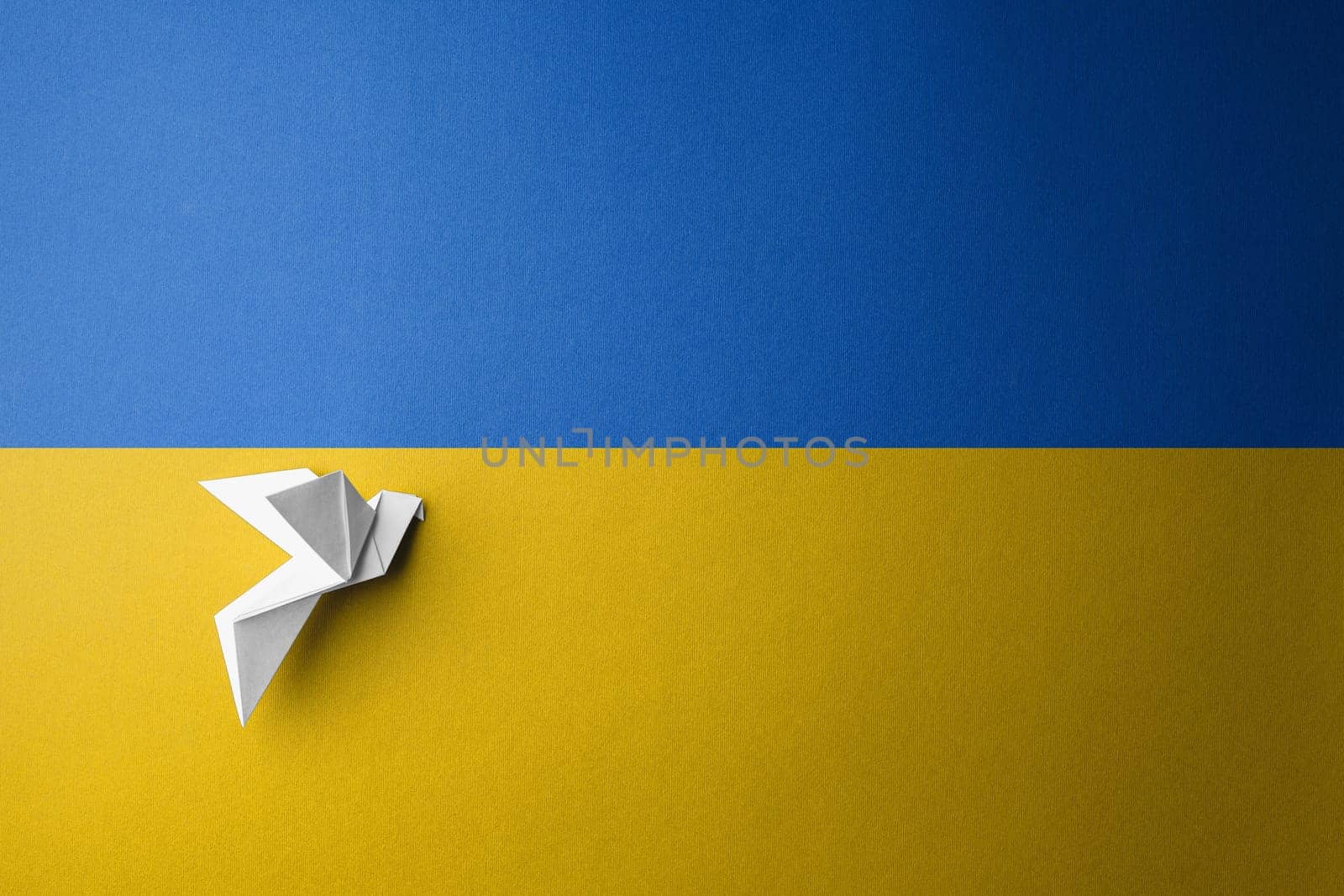 symbol of freedom white paper dove on the background of the flag of ukraine with blue yellow color. concept needs help and support, truth will win
