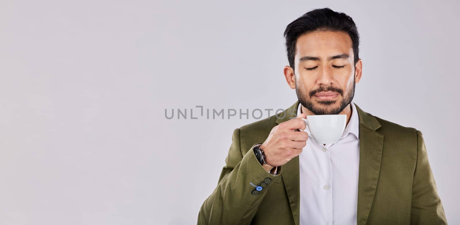 Mockup, coffee and Asian man with peace, relax and happy with guy against a grey studio background. Japan, male and gentleman with tea, peace and product placement with beverage, calm and backdrop.