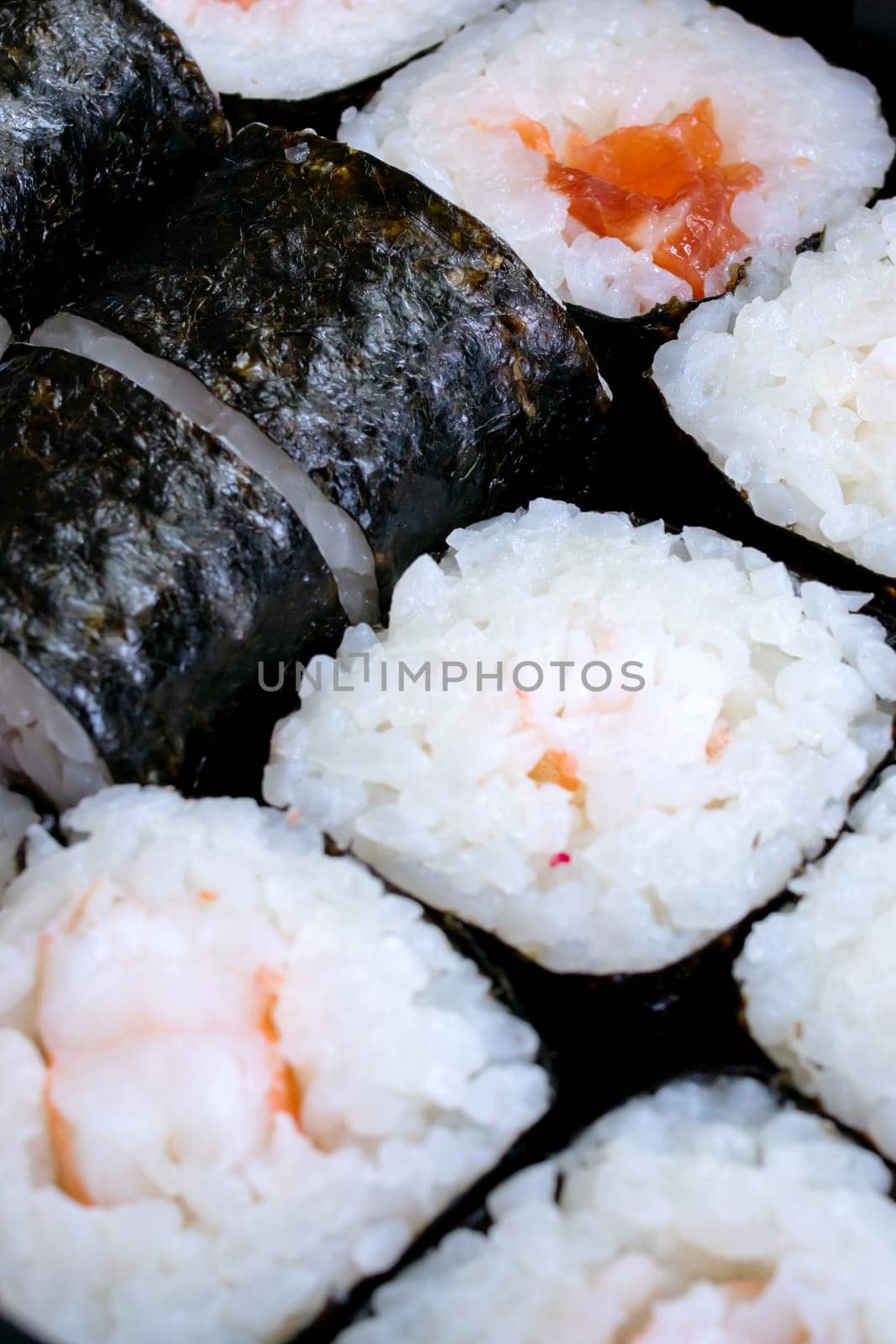 Various rolls with shrimps close up, background or texture