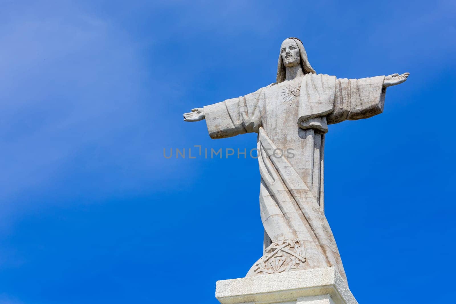 A statue of Jesus Christ with outstretched arms on the island of Madeira, Portugal.