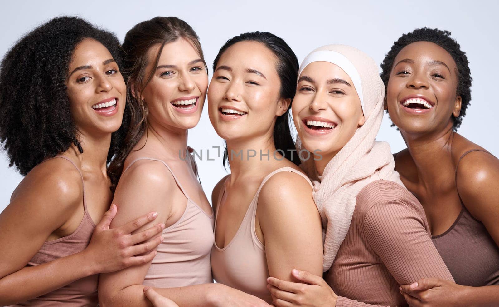 Portrait, beauty and diversity with woman friends in studio on a gray background together for inclusion. Happy, smile and solidarity with a model female group posing to promote real equality.