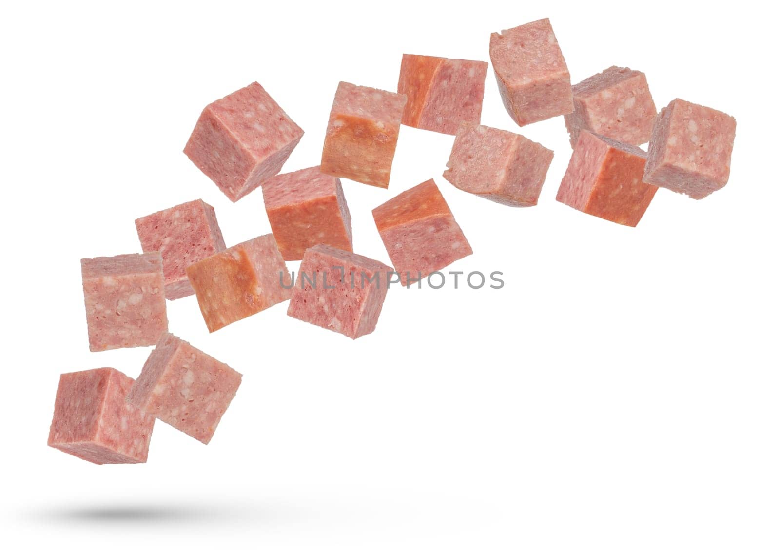 Flying sausage. Cubes of smoked sausage on a white isolated background. Salami cubes fall on a white background, for insertion into a design or project. by SERSOL