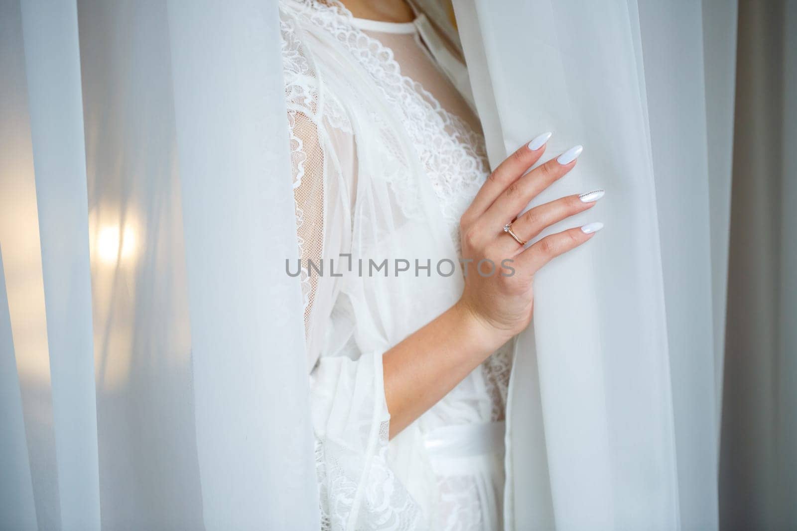 Beautiful bride in a white coat on a wedding day