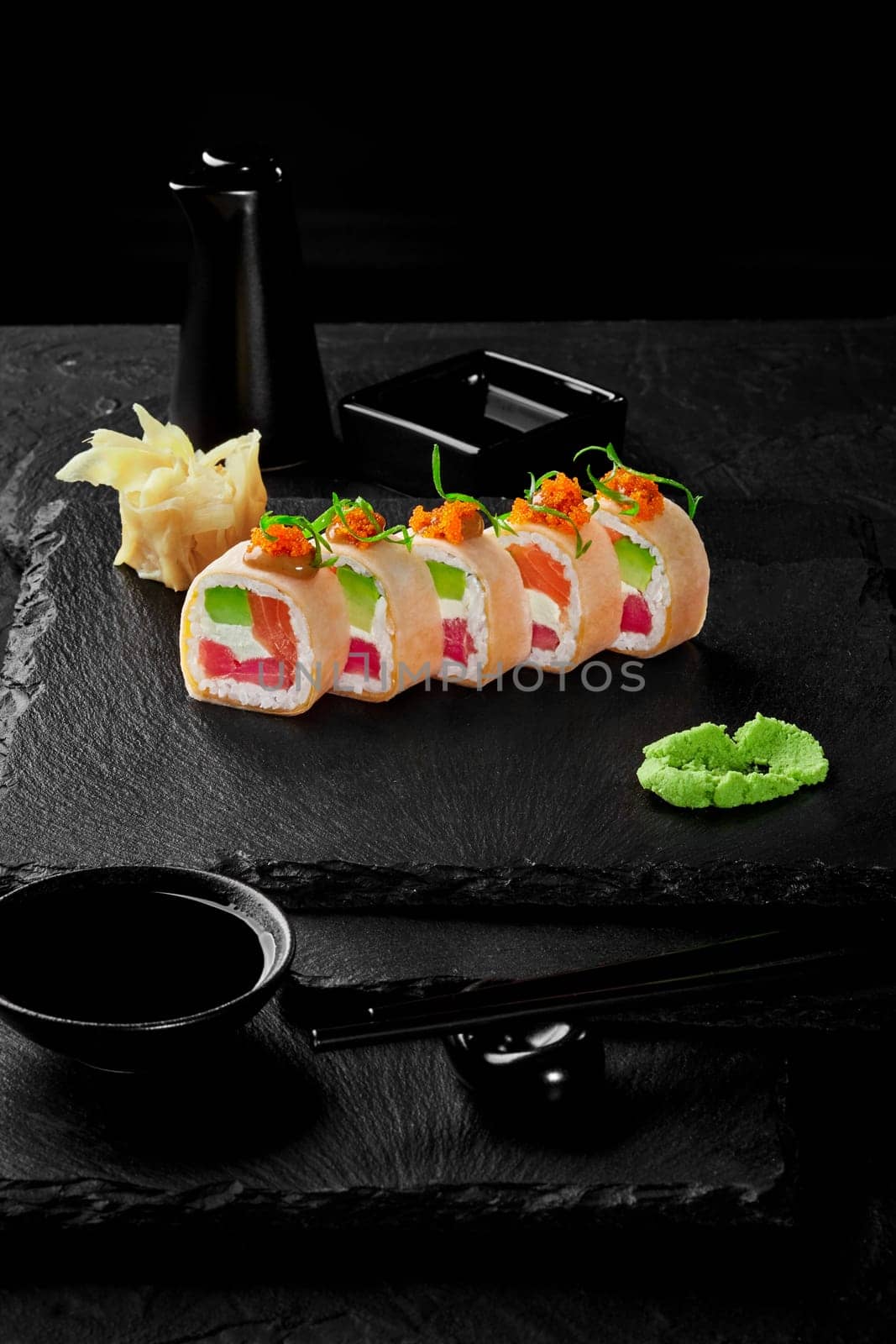 Rolls in mamenori with tuna, salmon, avocado, cream cheese and tobiko by nazarovsergey