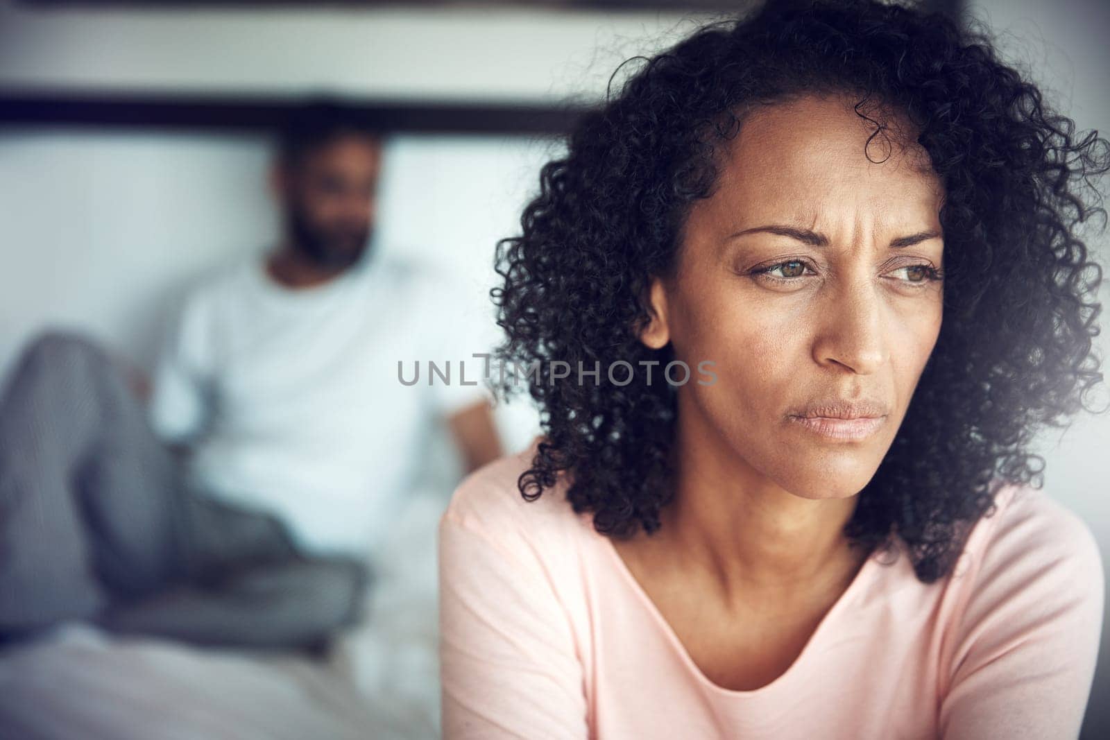 Divorce, angry black woman and couple in bedroom of their home or house. Marriage or relationship, communication or conflict and frustrated African female with breakup or couple problems inside.