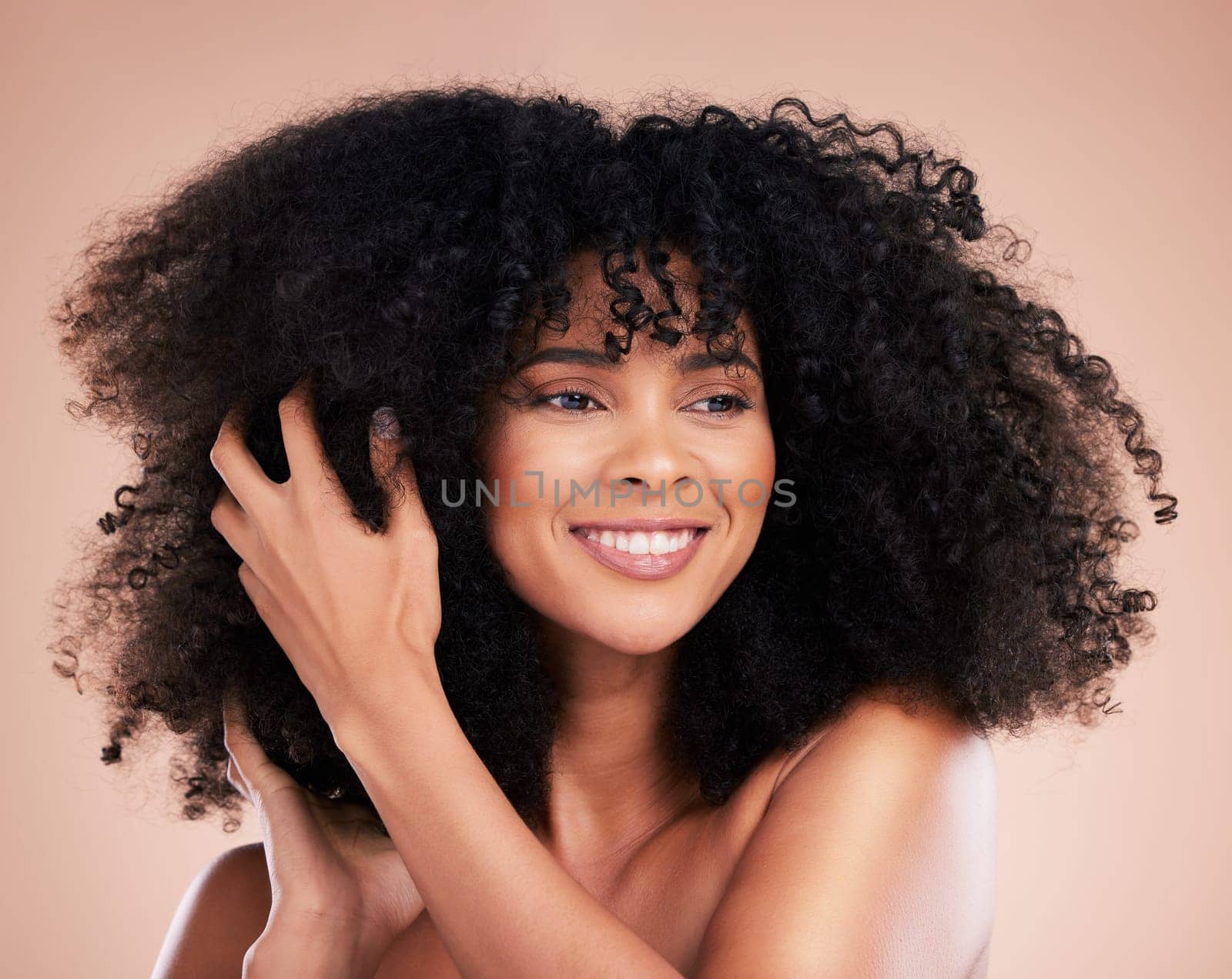 Black woman, afro hair or touching hands on isolated studio background in growth management, curly texture or skincare glow. Beauty model, happy or smile with natural hairstyle, keratin or collagen.