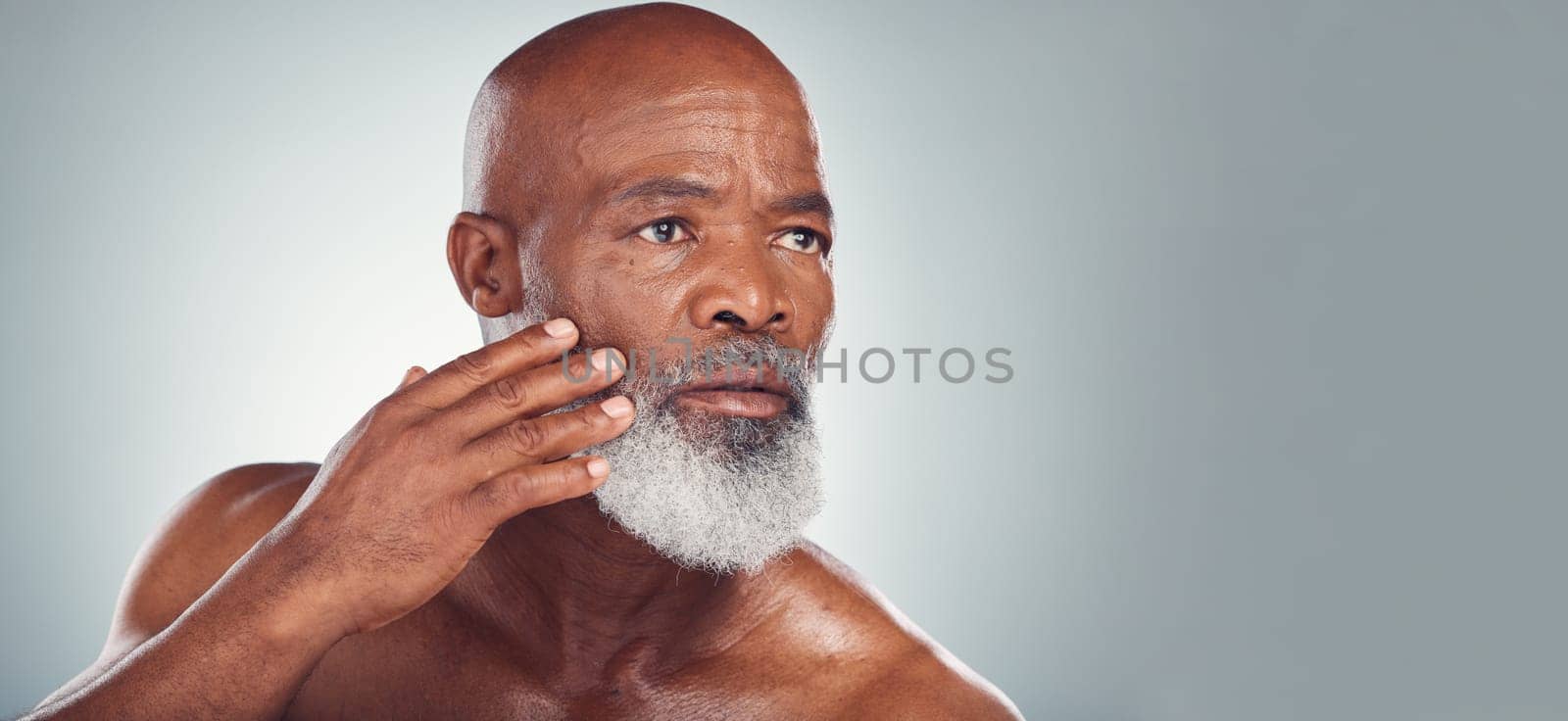 Skincare, grooming and face of black man for wellness, haircare and healthy skin on gray background. Beauty mockup, advertising and senior male pose for beard care, facial treatment and dermatology by YuriArcurs