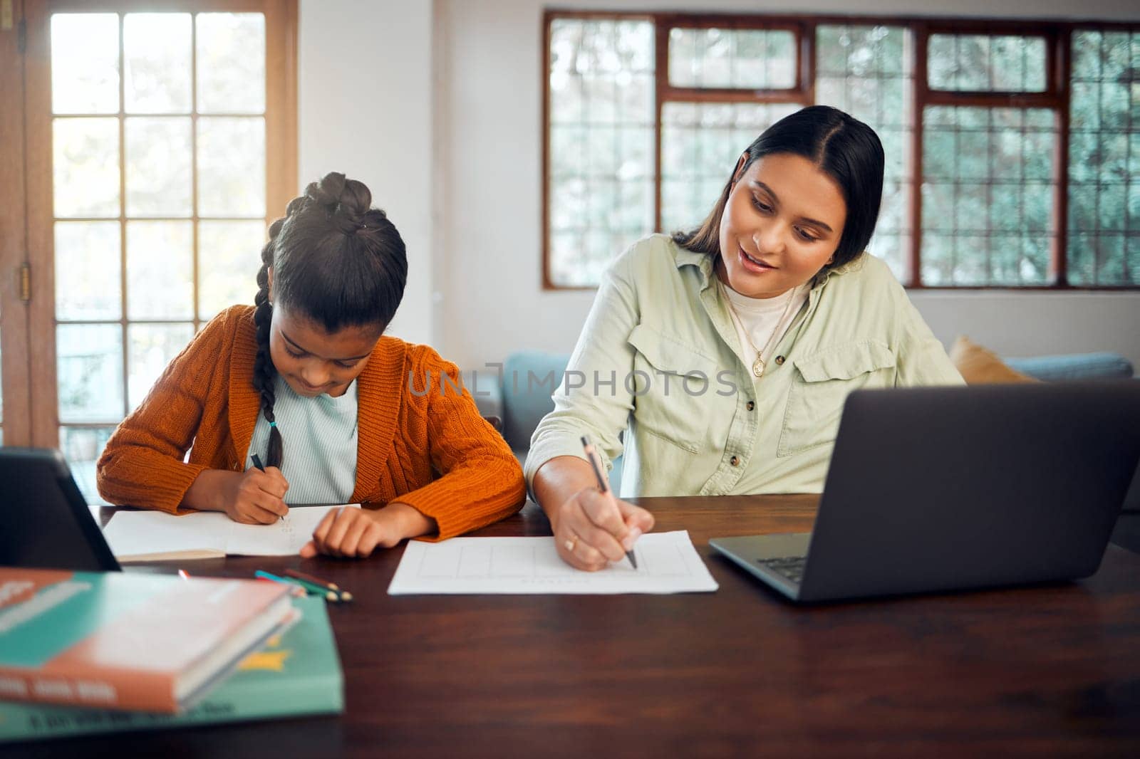 Help, education and homework with girl and mother writing for work from home, support and education. Laptop, virtual and remote learning with student and mom for development, home school and online.