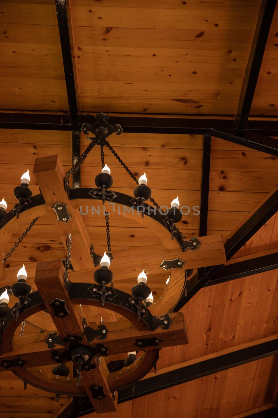 Medieval chandelier with burnt out candlesin medieval style, Closeup.