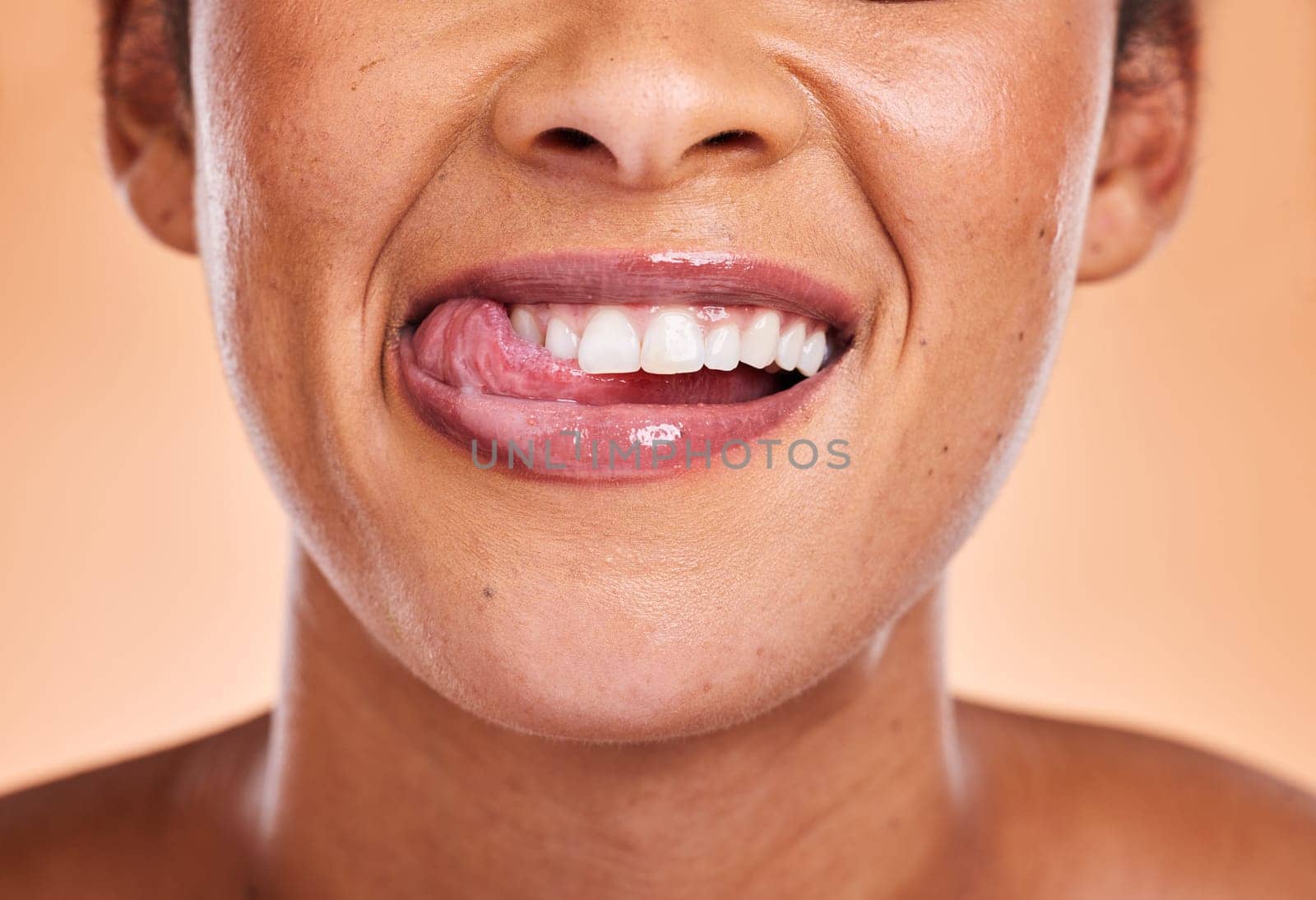 Woman, mouth and smile with teeth for dental care, cosmetics or surgery against a studio background. Female smiling in satisfaction for medical tooth, oral or gum care wellness and treatment.