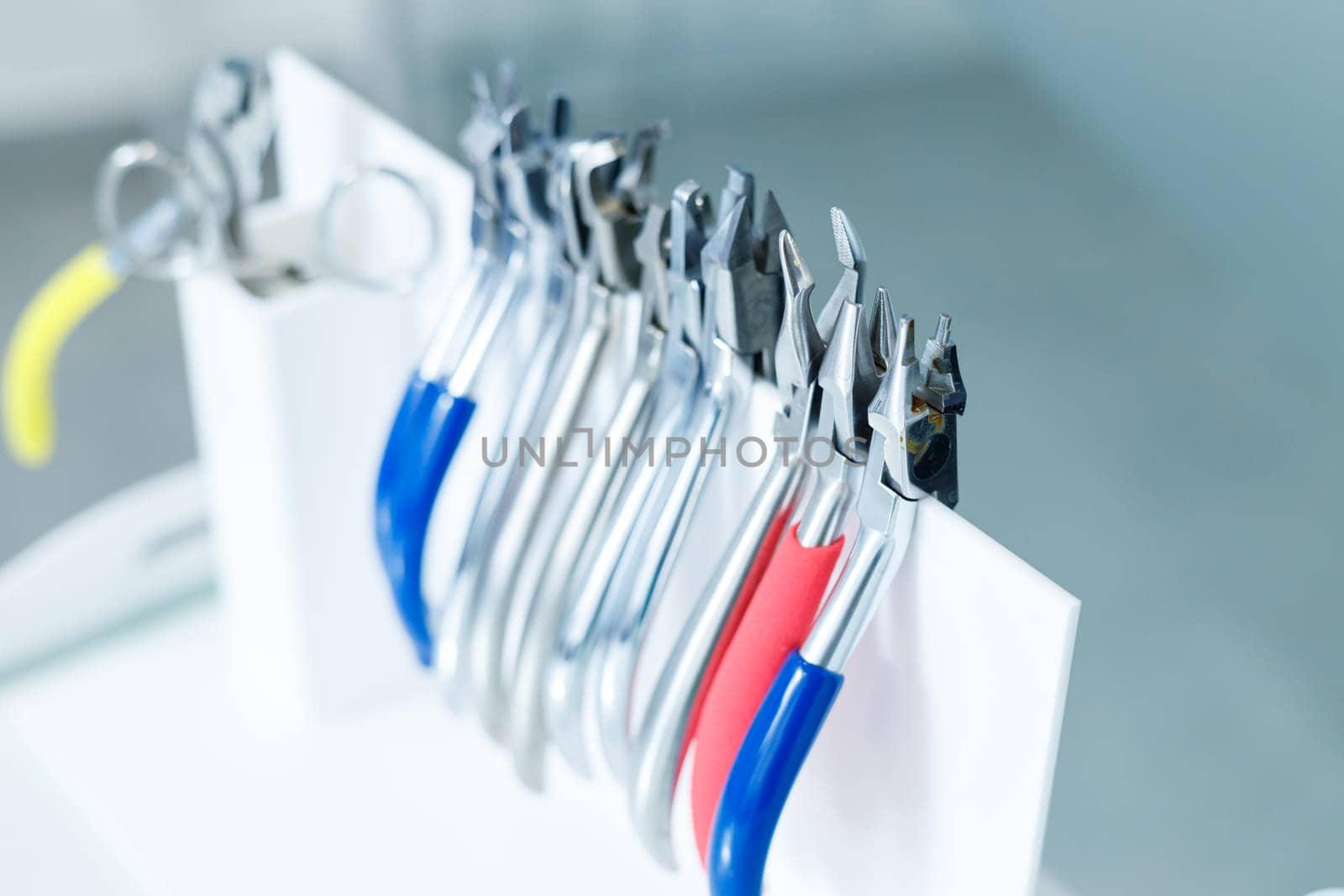 Orthodontic metal forceps for dental treatment. Orthodontic instruments by Dmitrytph