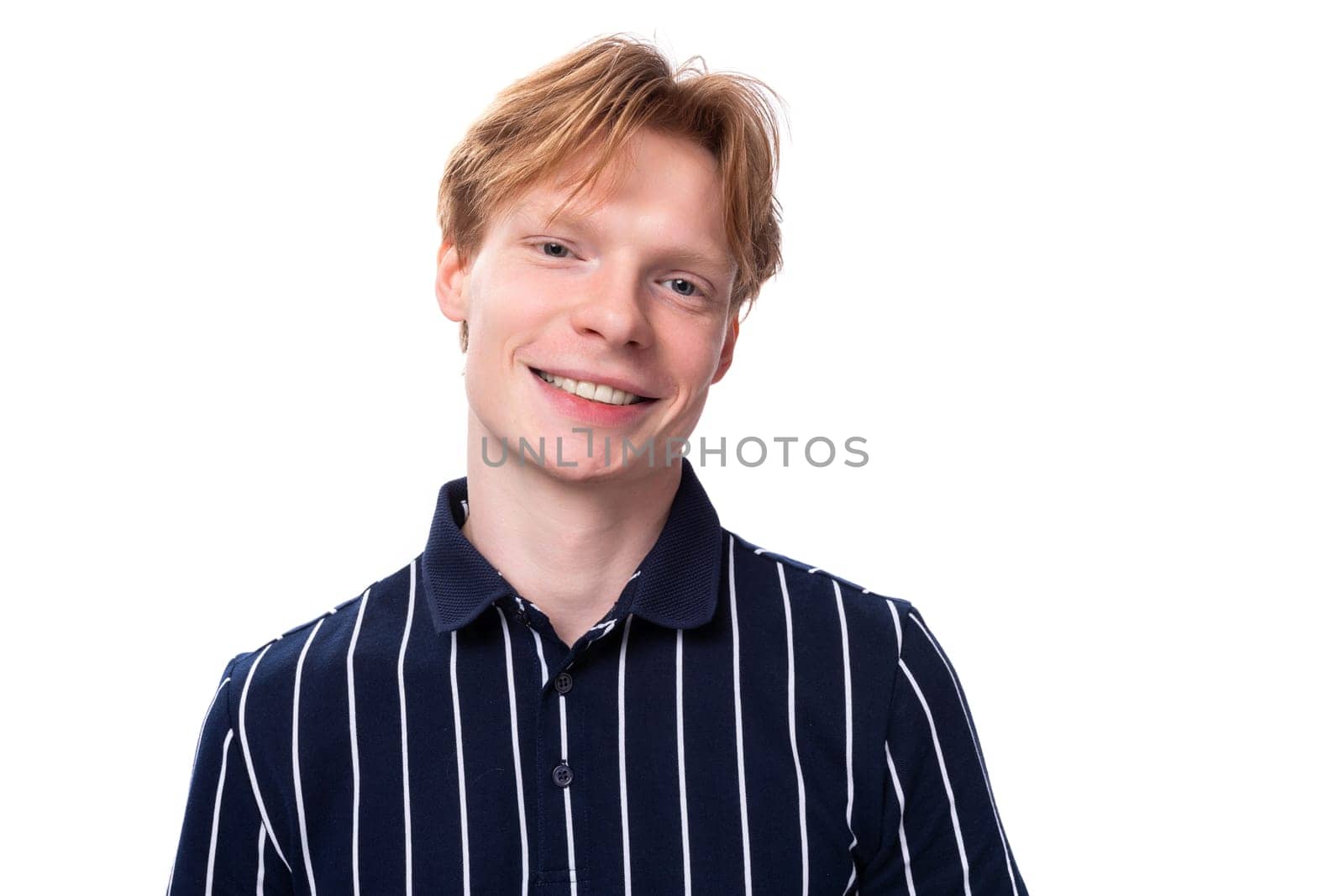 handsome young blond man in blue polo with short haircut by TRMK