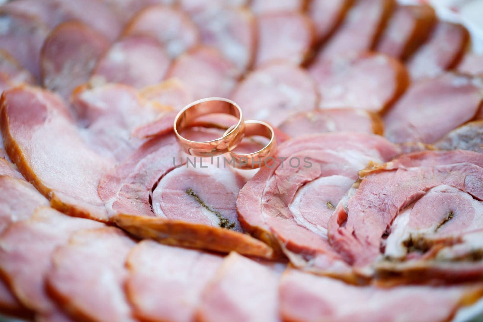 Golden wedding rings for newlyweds on their wedding day by Dmitrytph