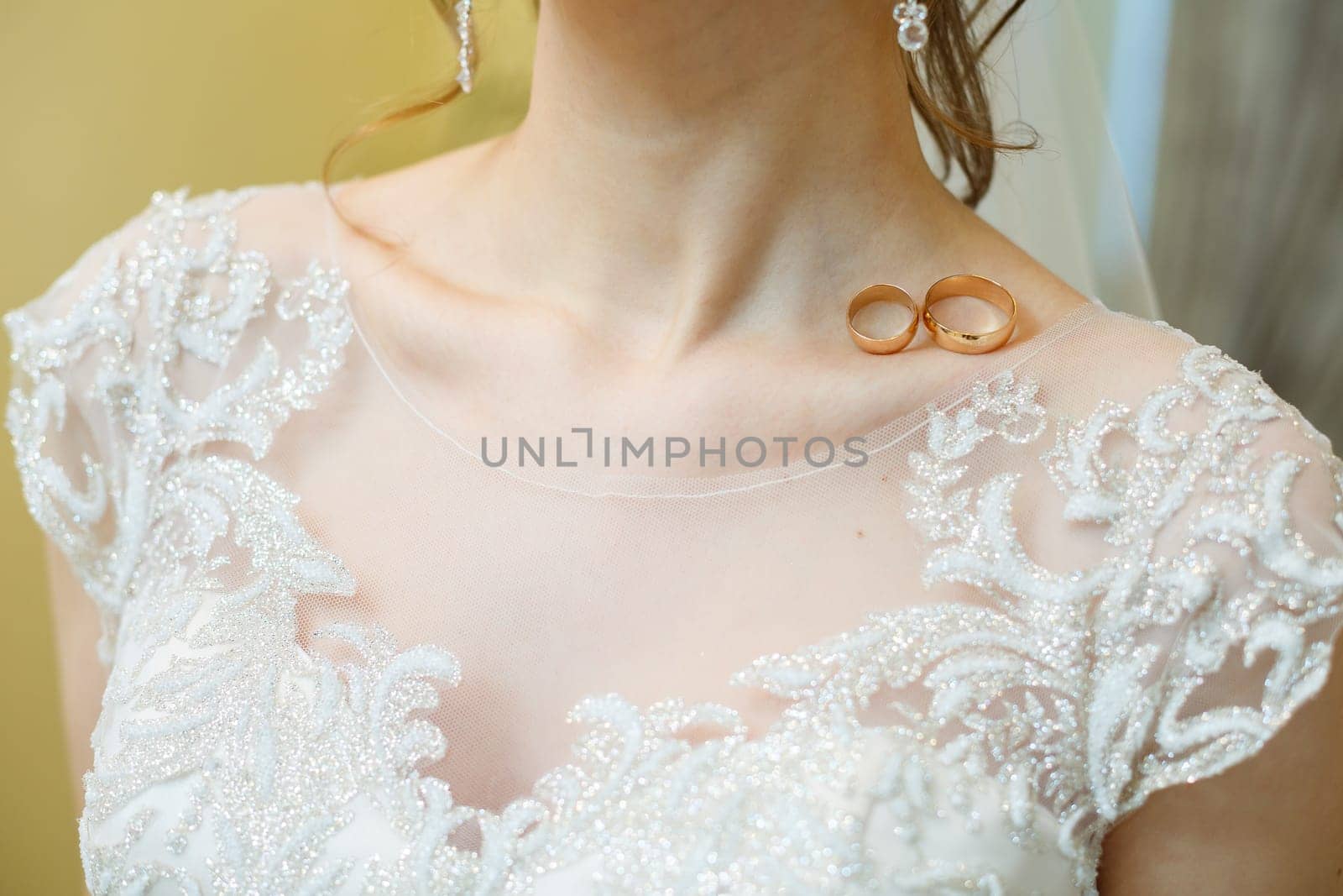 Golden wedding rings for newlyweds on their wedding day