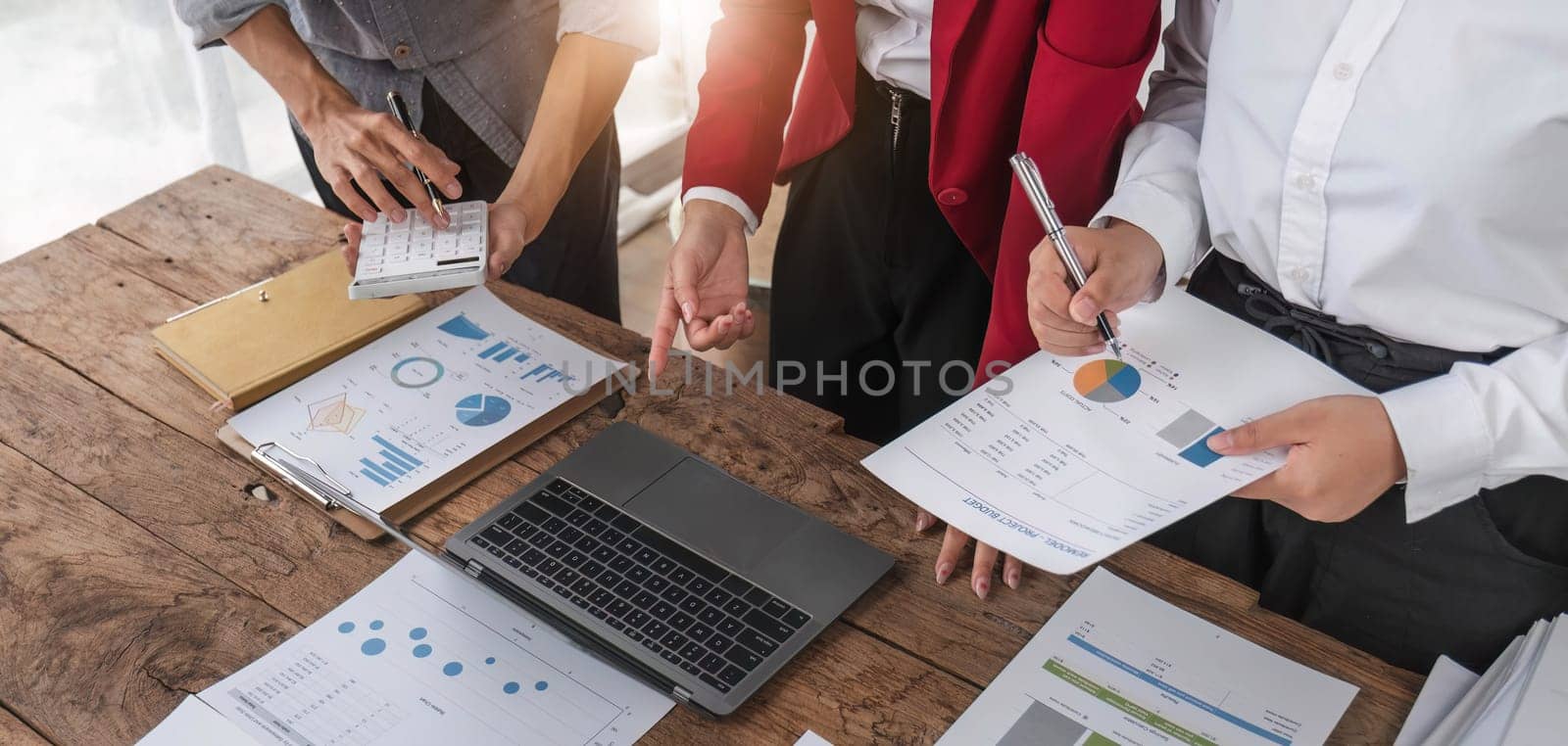 Business People Meeting using laptop computer,calculator,notebook,stock market chart paper for analysis Plans to improve quality next month. Conference Discussion Corporate Concept.. by wichayada