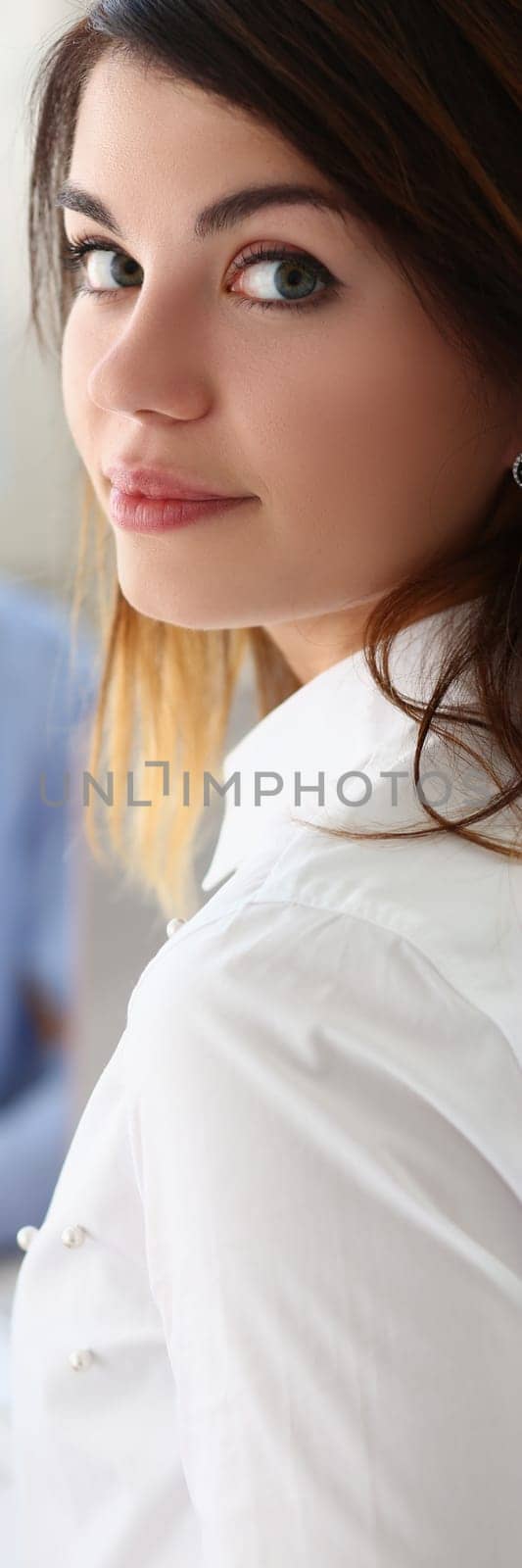 Portrait of woman holding financial chart analytics in hands and discussing with colleague. Business statistics report of commercial indicators