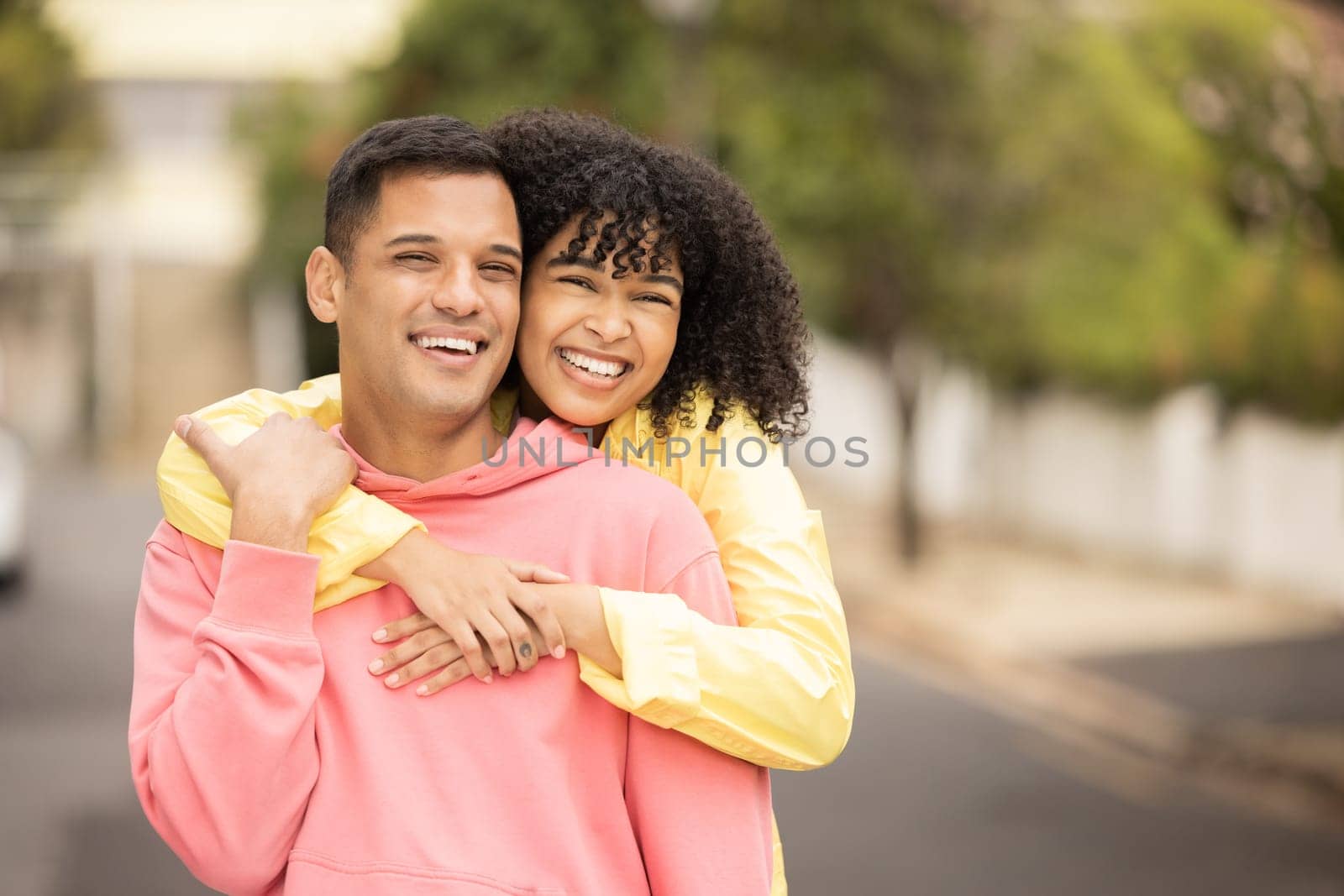 Black couple, smile and hug portrait of young people with love, care and bonding outdoor. Happy woman, man and summer fun of people on a street walking with happiness on vacation smiling together.