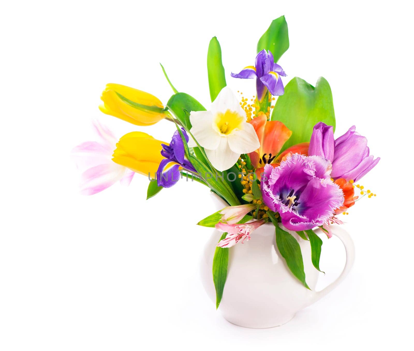 Bright spring bouquet in a white vase. spring flowers, daffodils, tulips, hyacinths, irises and mimosa isolated on a white background by aprilphoto