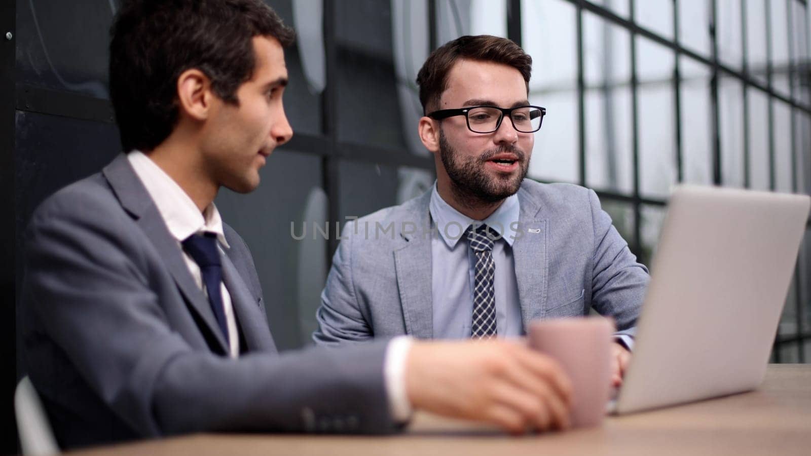 Business Having Meeting Around Table In Modern Office by Prosto