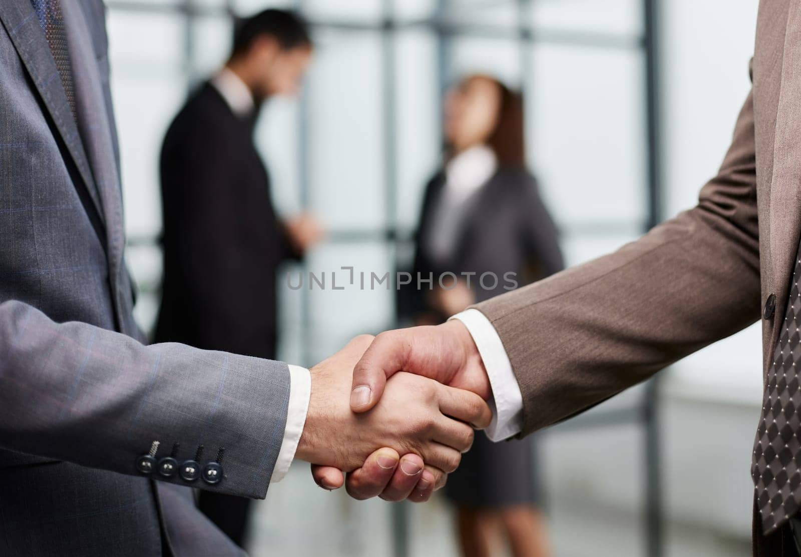 Nice to meet you. Close-up of two young businessmen shaking hands