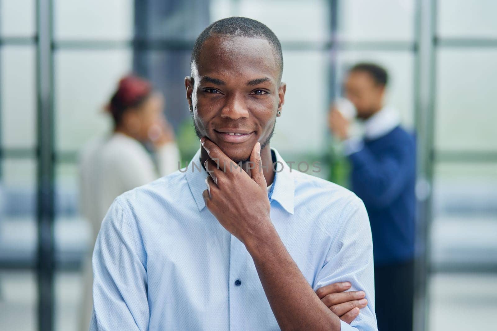 Portrait of a young African American businessman at his workplace waiting for inspiration while