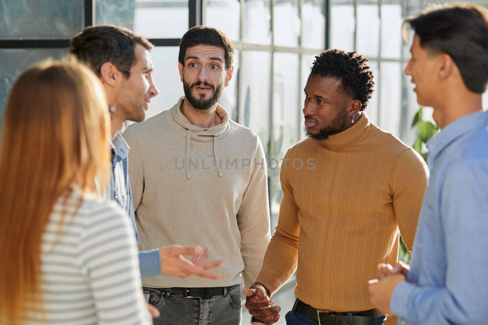 Group portrait of a professional business team having a discussion in the lobby of the office