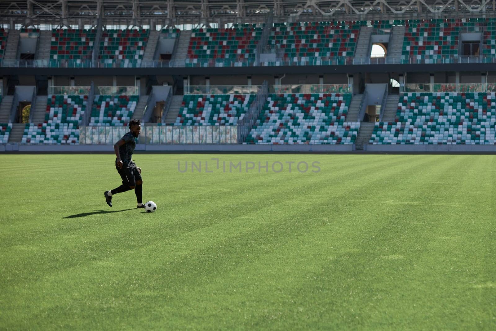 Professional football player in action at the stadium. The concept of sport, competition, movement, overcoming. The effect of the presence of the field.