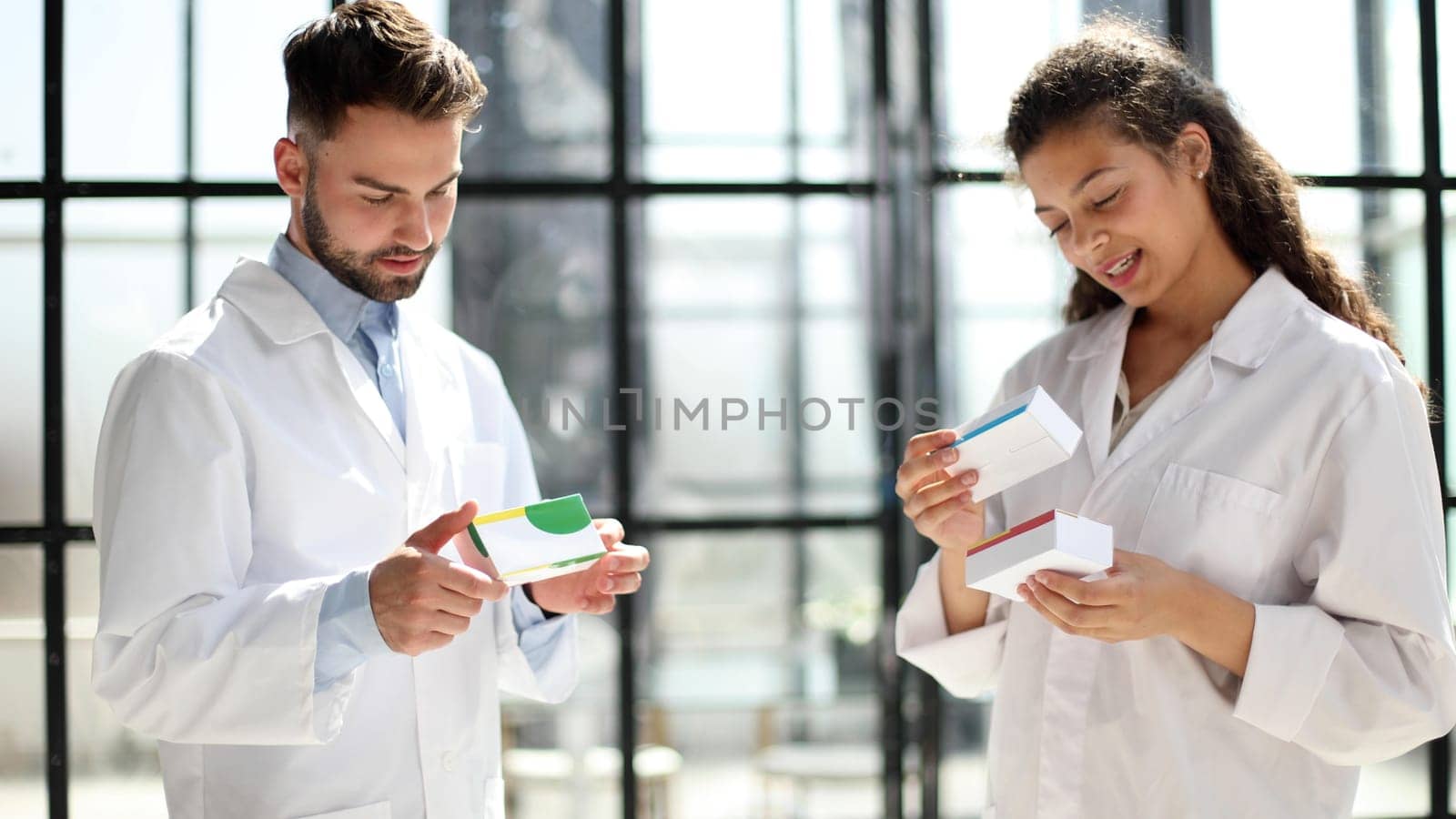 doctors read the dosage of the drug while standing in the lobby of the hospital