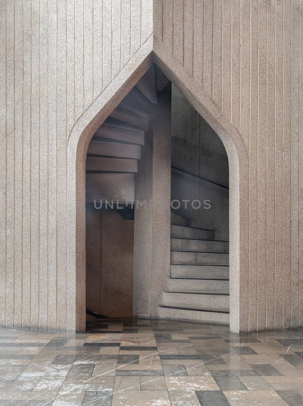 Bangkok,Thailand - May 28, 2023 - View of the stone arched entrance leads to the stone staircase. Architecture Exterior of the Stone arch and stone staircase in the background, Classic construction of the old stairs. Selective focus.