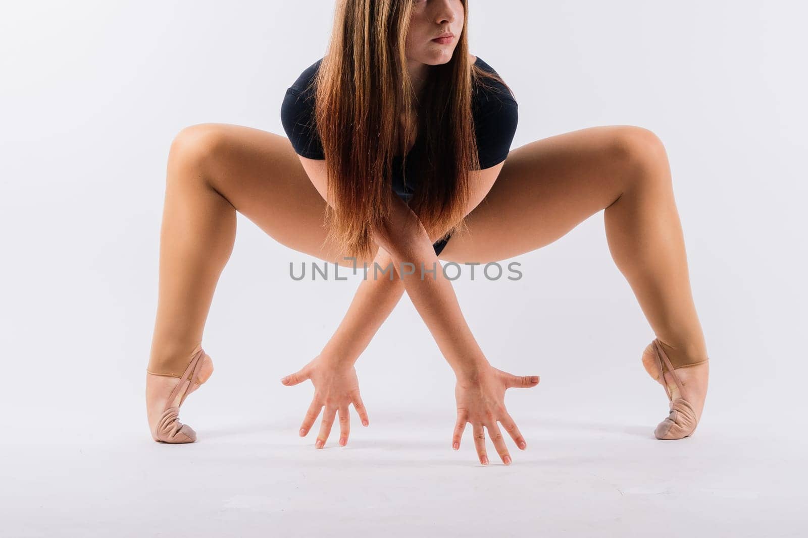 Full length teen girl smiling doing fitness exercises, isolated on white and dark background by Zelenin