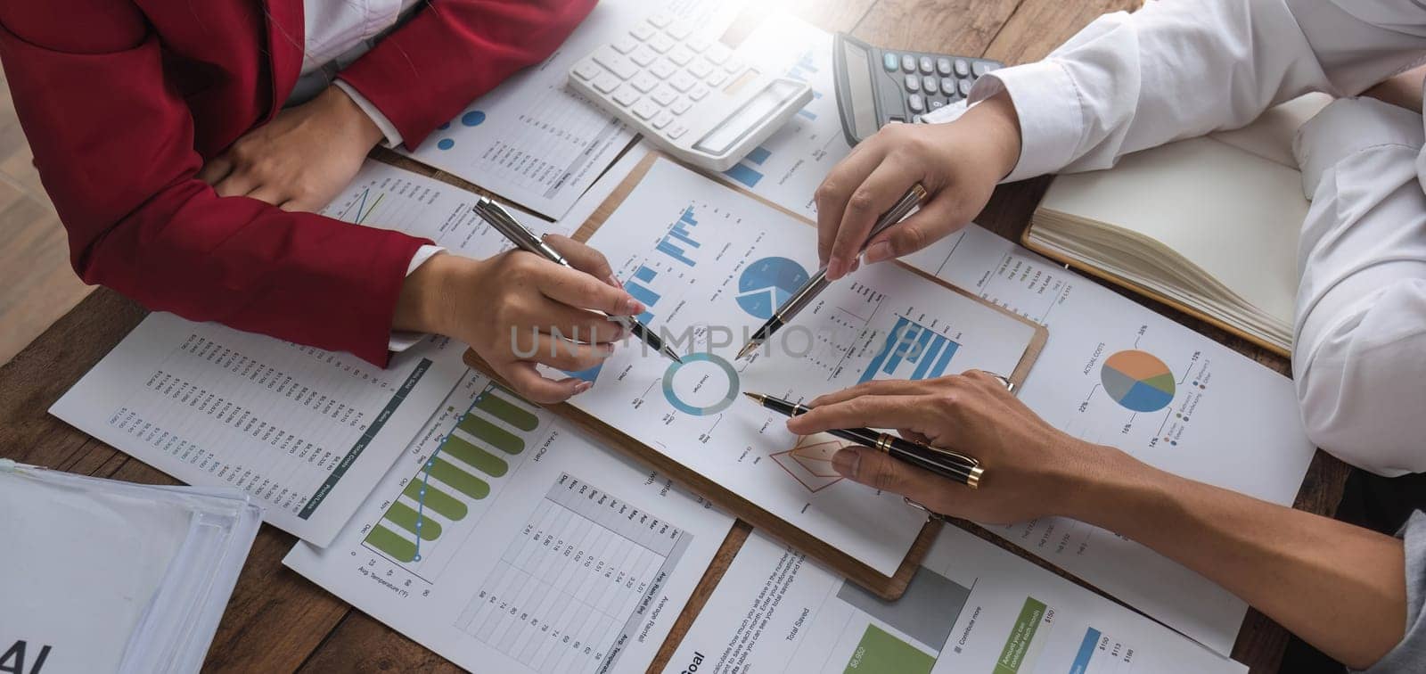 Business People Meeting using laptop computer,calculator,notebook,stock market chart paper for analysis Plans to improve quality next month. Conference Discussion Corporate Concept.. by wichayada