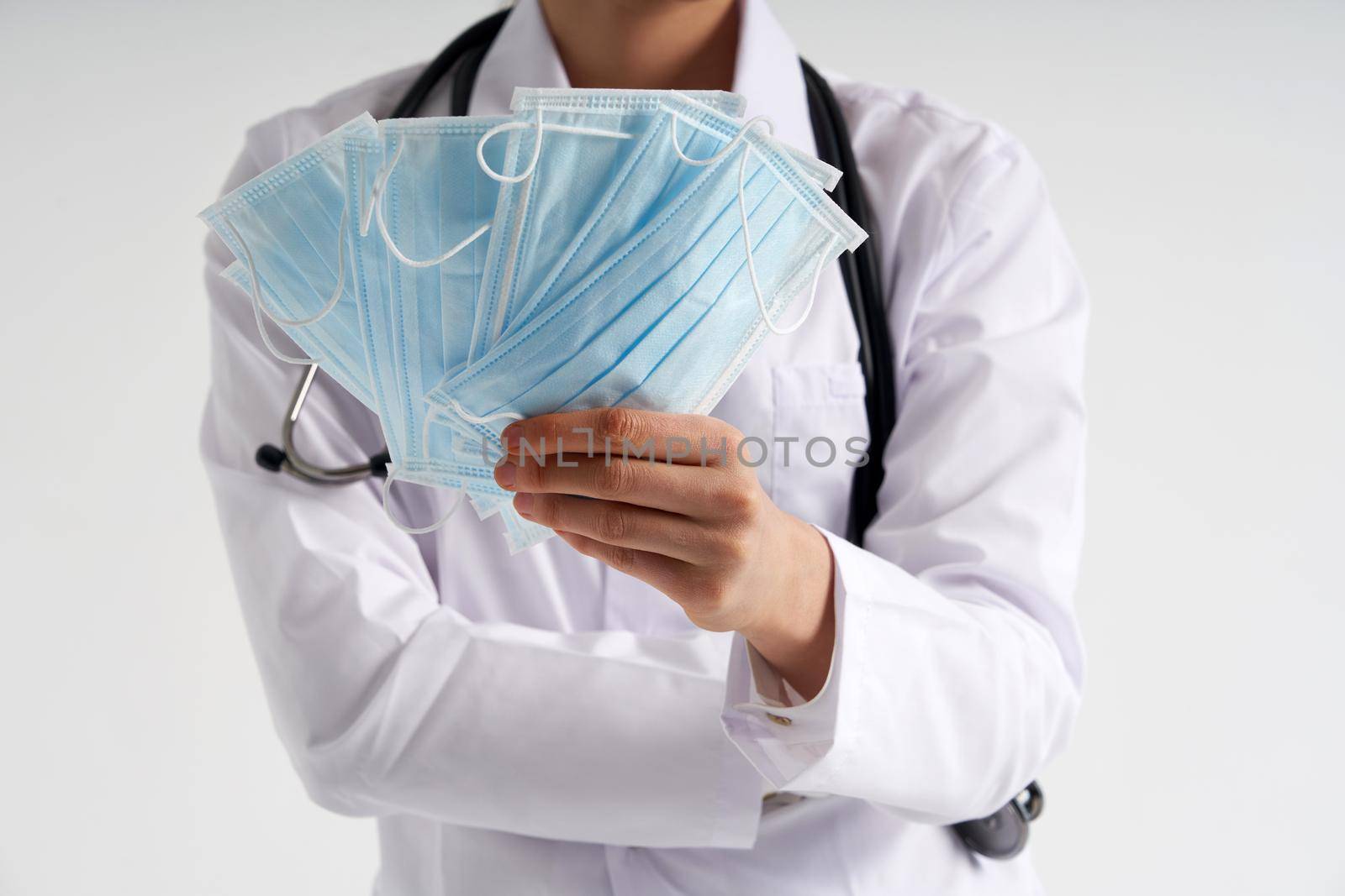 Doctor or nurse recommend to use protective face mask to protect from virus infection