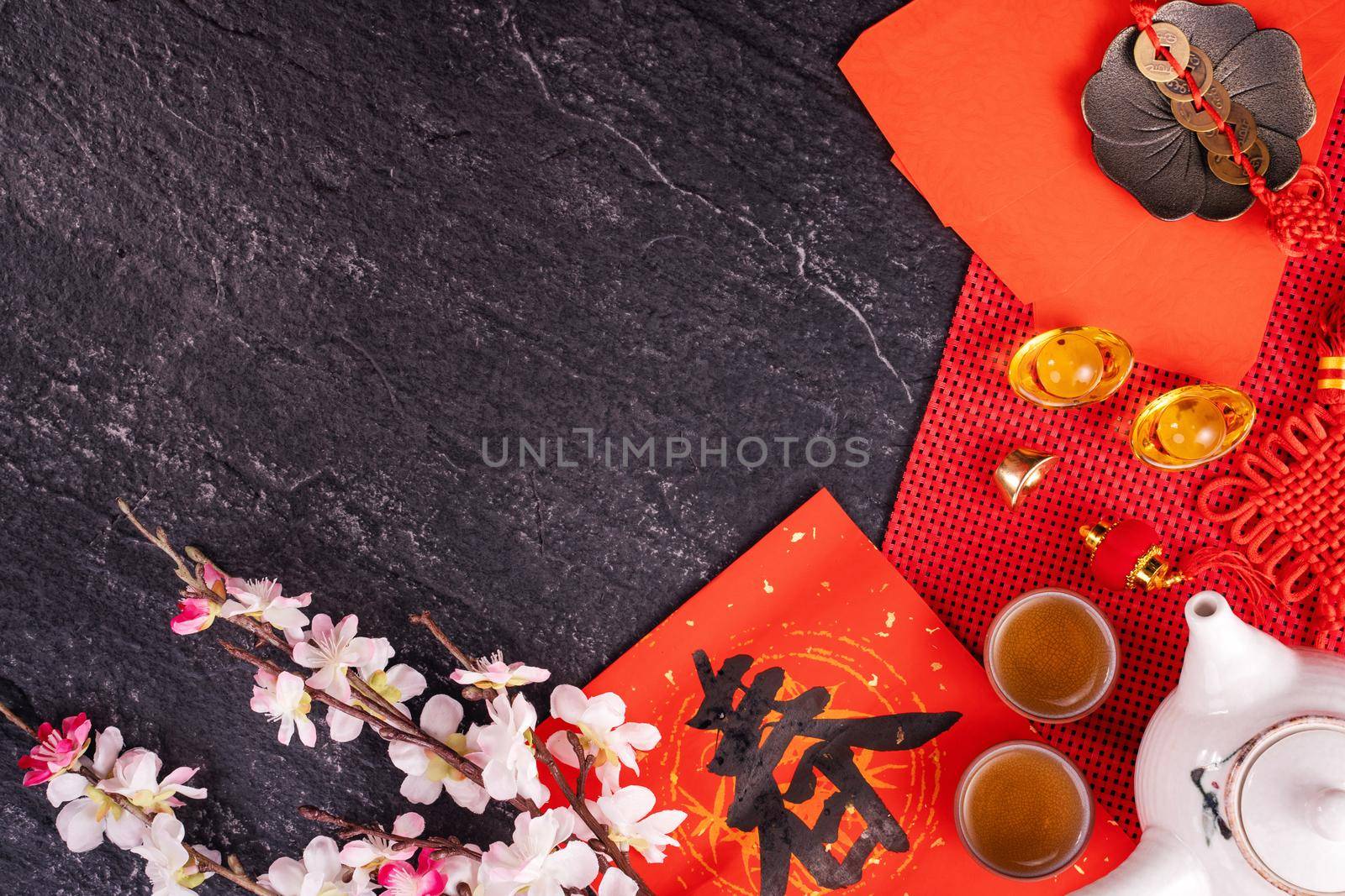 Design concept of Chinese lunar January new year - Festive accessories, red envelopes (ang pow, hong bao), top view, flat lay, overhead above. The word 'chun' means coming spring.