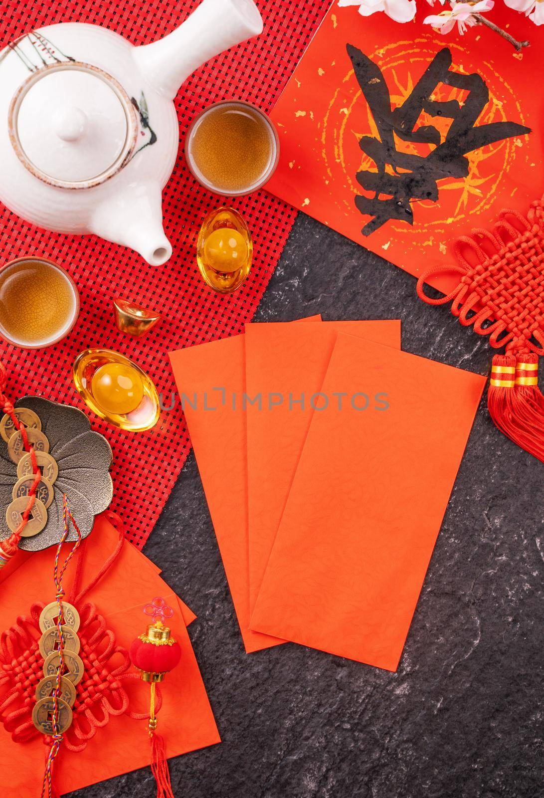 Design concept of Chinese lunar January new year - Festive accessories, red envelopes (ang pow, hong bao), top view, flat lay, overhead above. The word 'chun' means coming spring. by ROMIXIMAGE