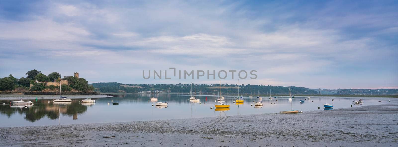 boats in river la rance in french region of brittany at sunrise in summer by ahavelaar