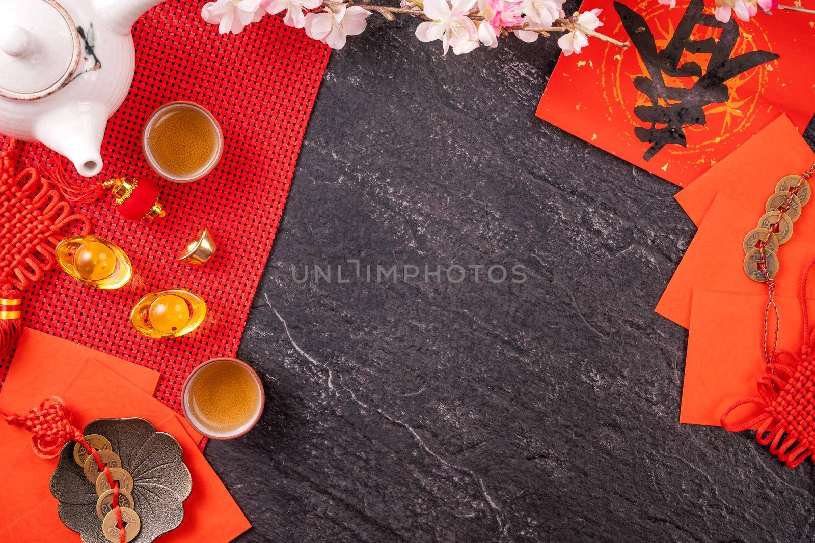 Design concept of Chinese lunar January new year - Festive accessories, red envelopes (ang pow, hong bao), top view, flat lay, overhead above. The word 'chun' means coming spring.