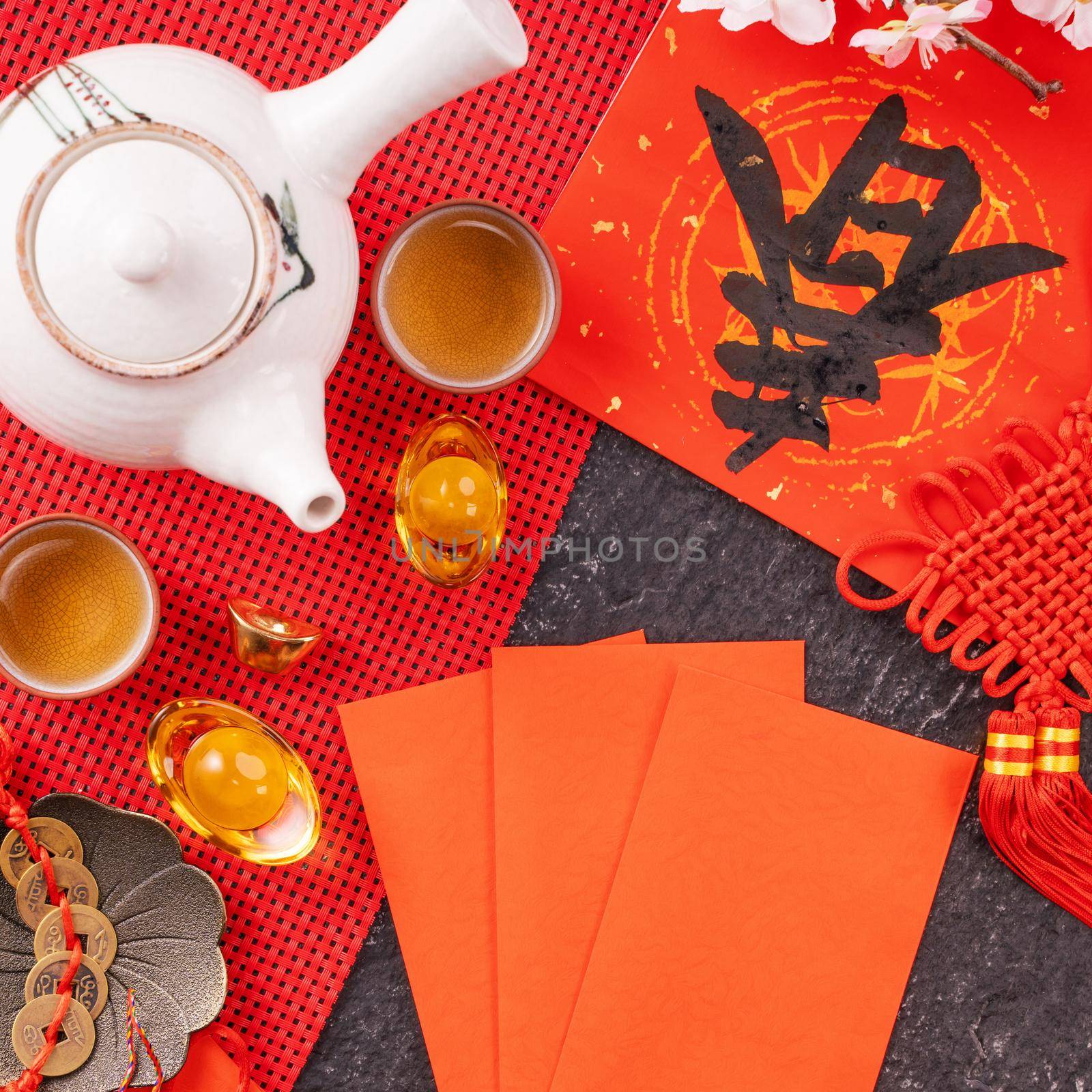 Design concept of Chinese lunar January new year - Festive accessories, red envelopes (ang pow, hong bao), top view, flat lay, overhead above. The word 'chun' means coming spring.