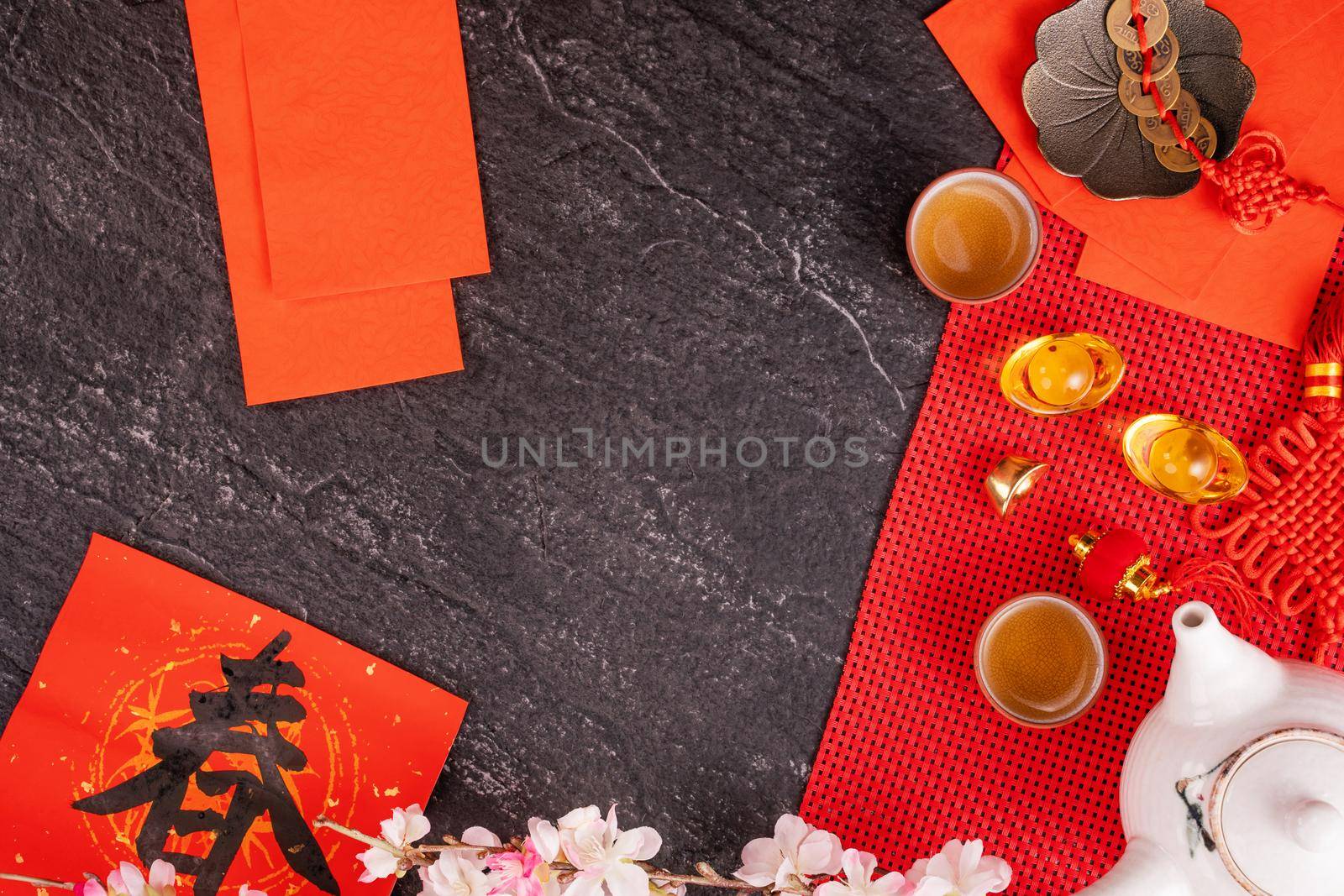 Design concept of Chinese lunar January new year - Festive accessories, red envelopes (ang pow, hong bao), top view, flat lay, overhead above. The word 'chun' means coming spring.