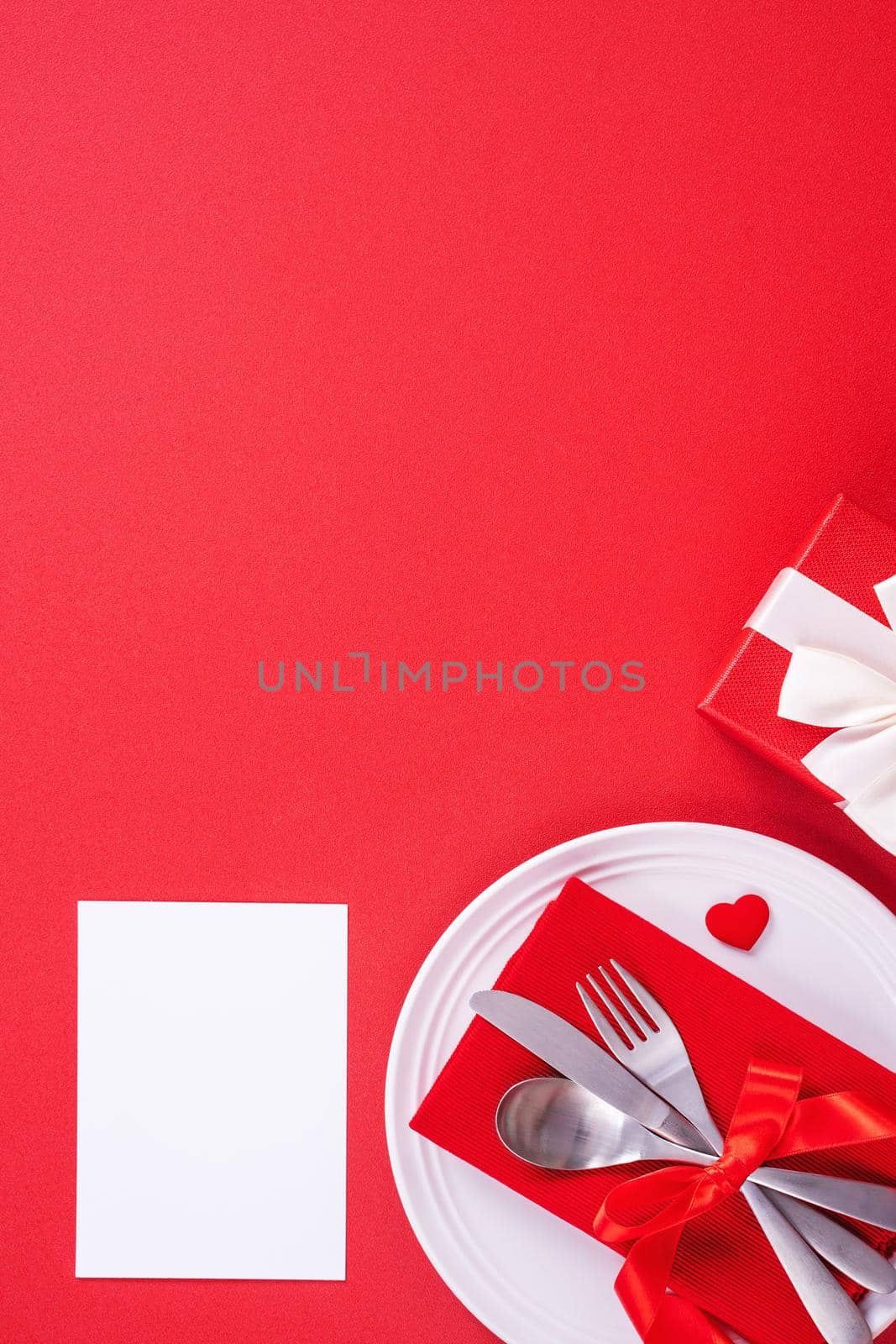 Valentine's Day meal design concept - Romantic plate dish set isolated on red background for restaurant, holiday celebration promotion, top view, flat lay. by ROMIXIMAGE