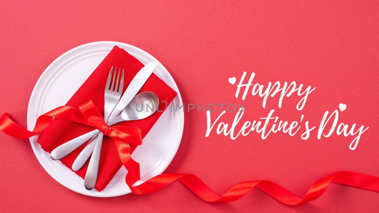 Valentine's Day holiday dating meal, banquet greeting card design concept - White plate with cutlery on red background, top view, flat lay. by ROMIXIMAGE