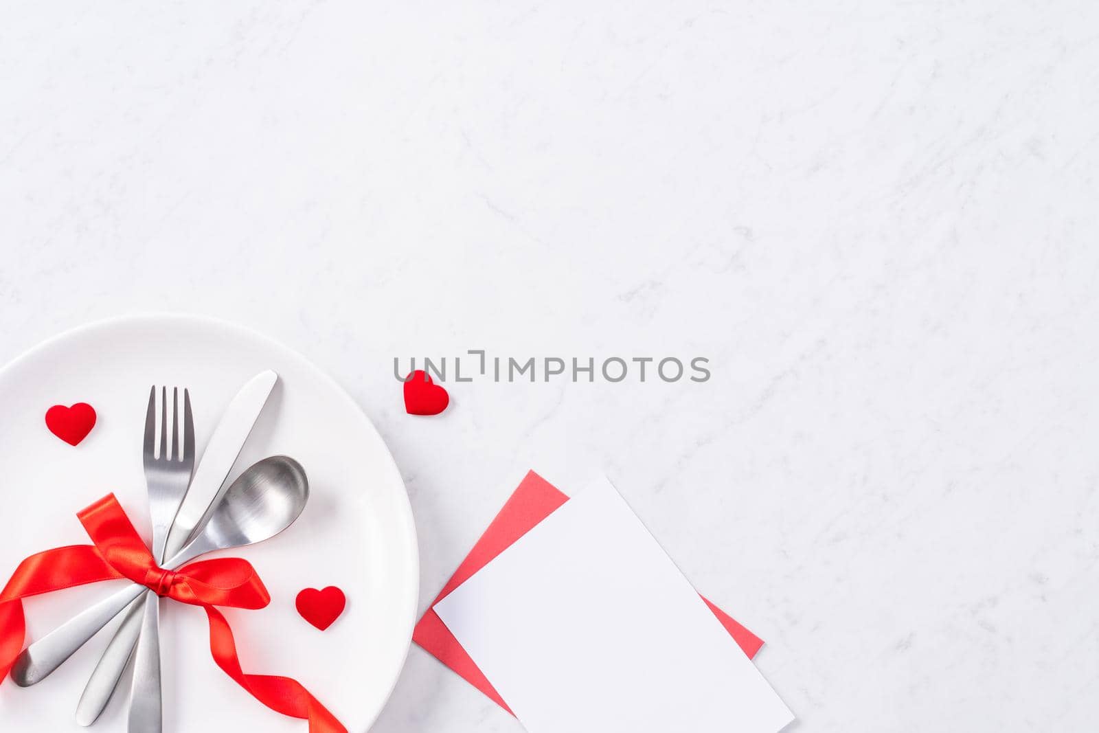 Valentine's Day meal design concept - Romantic plate dish set isolated on marble white background for restaurant holiday celebration promo, top view, flat lay.