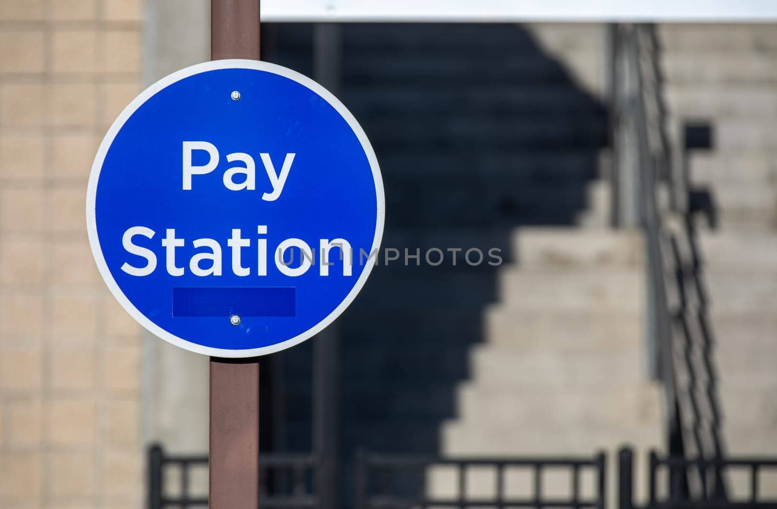 blue pay station sign to enter an area