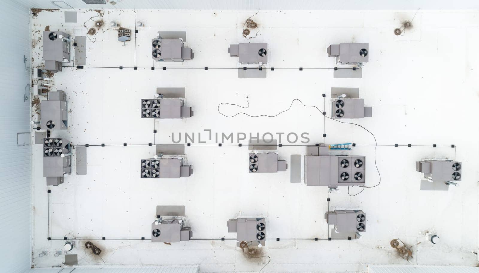 aerial view of a rooftop with multiple HVAC units to heat and cool the air