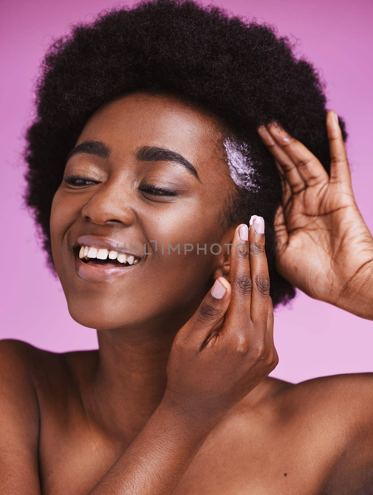 Black woman, hair and smile with afro conditioner, haircare and ethnic texture on pink studio background. African model, cosmetics cream product and scalp relaxer for maintenance, skincare and beauty.