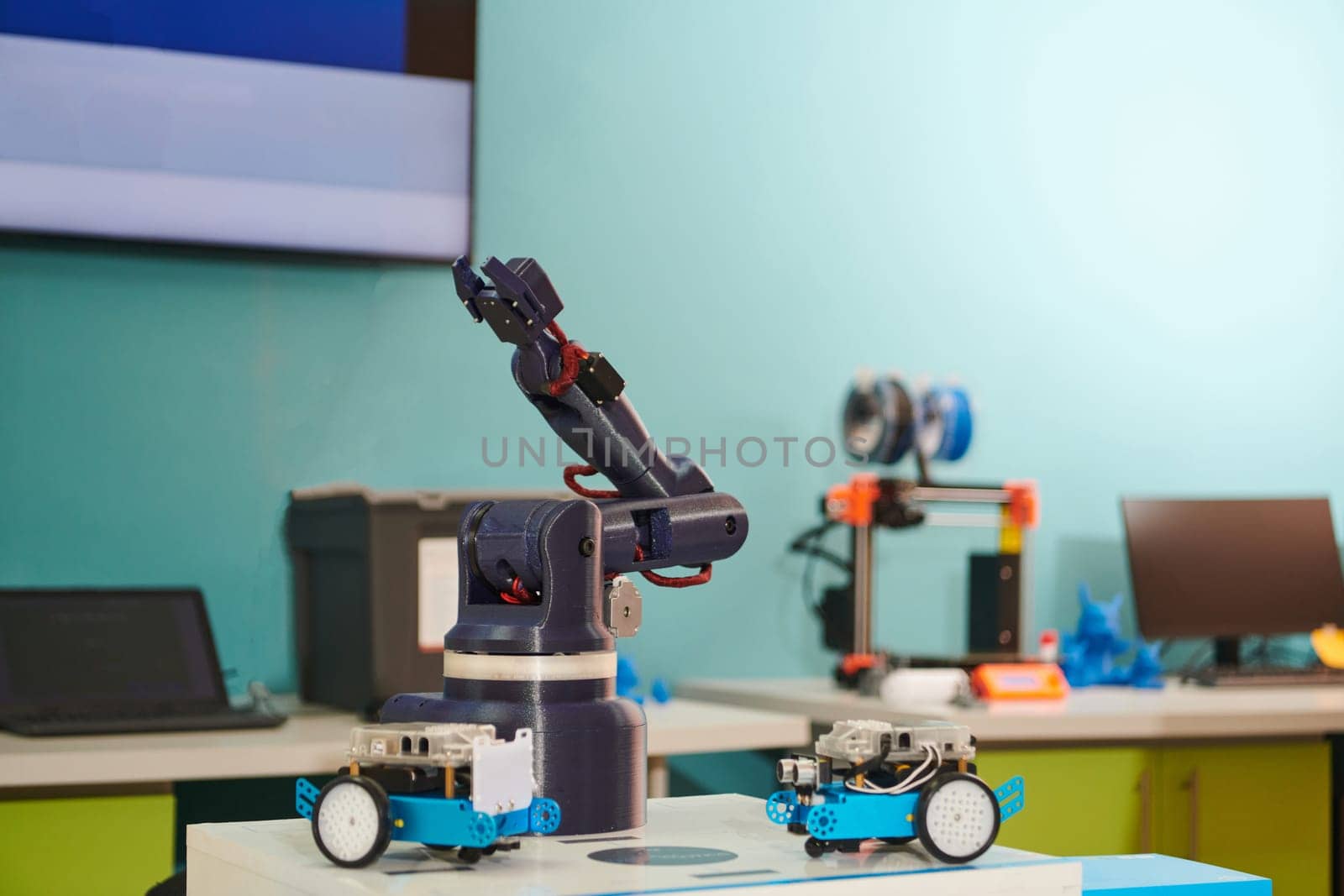 Modern equipment for robotics and a 3d printer for modeling on a table in a laboratory by dotshock