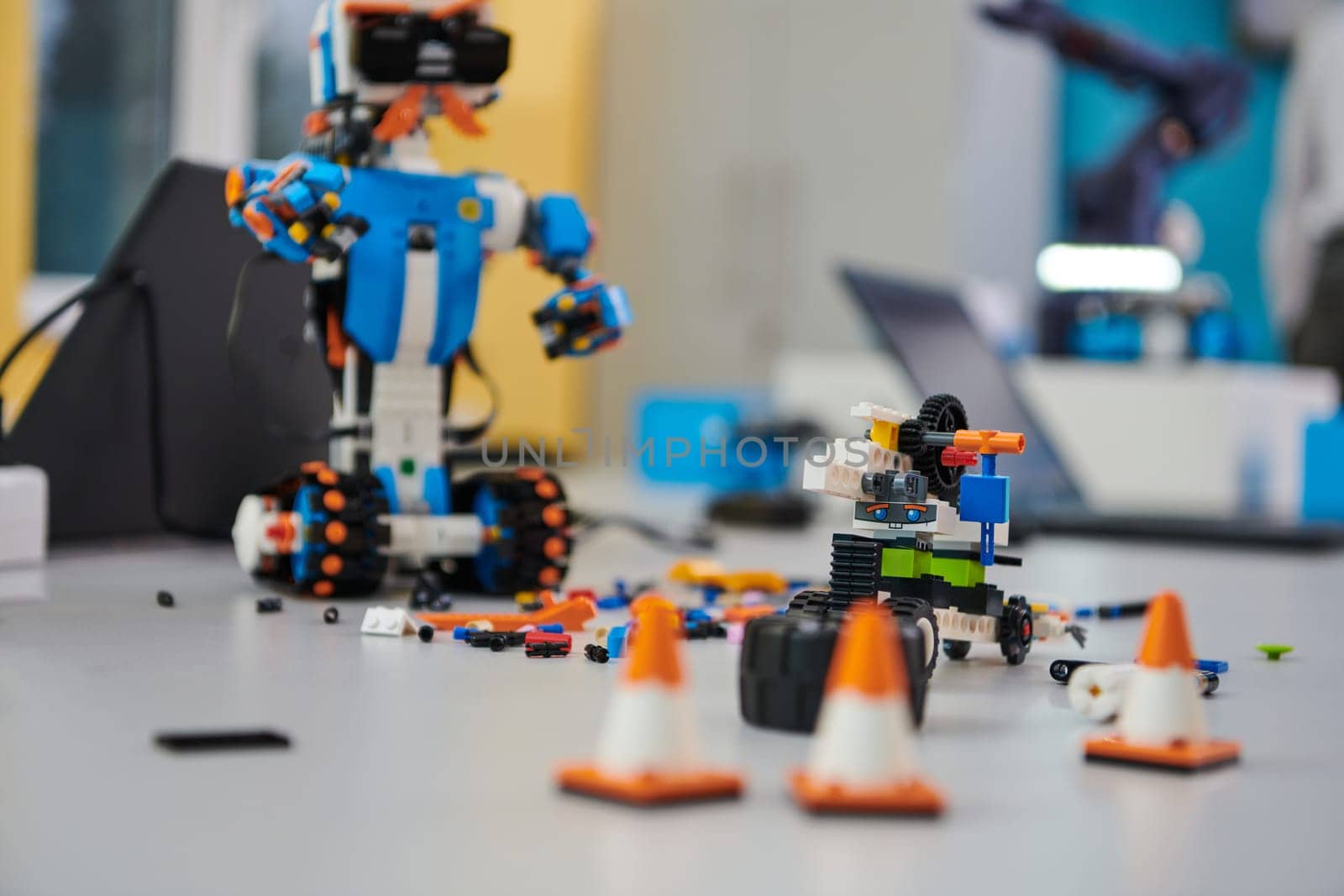 Various components and installations for robot fabrication fill the space, representing the intricate blend of technology, engineering, and innovation involved in the development and assembly of advanced robotic systems. by dotshock