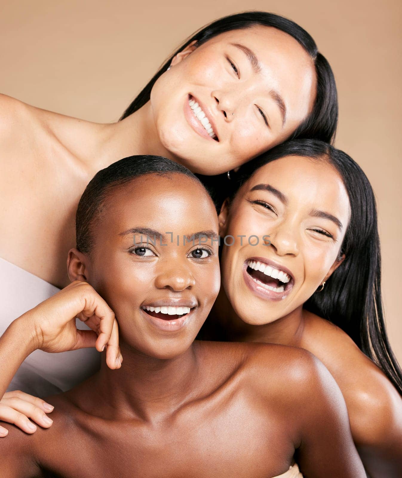 Friends, diversity and skincare, women smile together in happy portrait on studio background. Health, wellness and luxury cosmetics for skin care and beautiful multicultural people in natural makeup. by YuriArcurs
