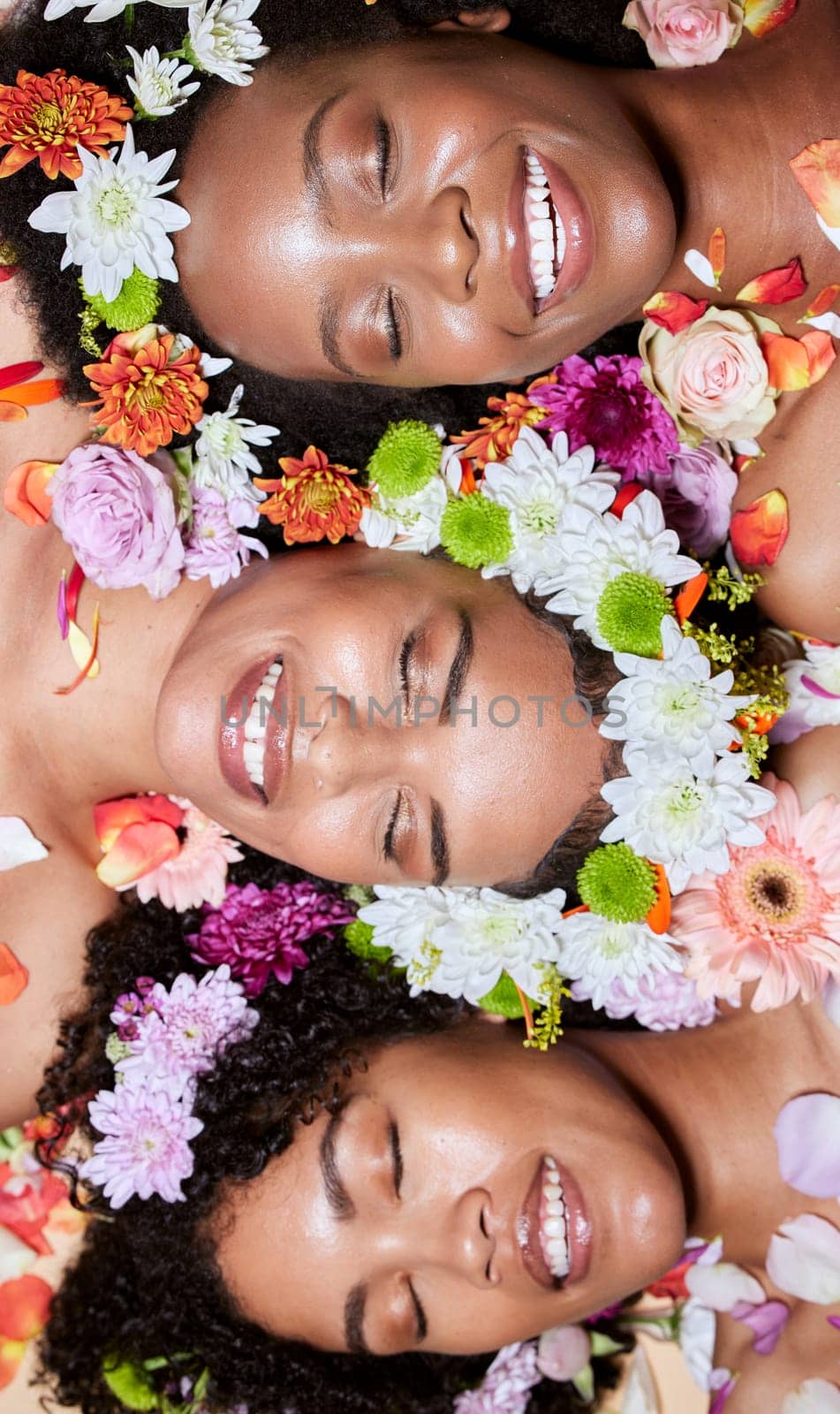 Black women, flowers and skincare wellness of diversity, cosmetic and facial health with plants. Black woman top view with cosmetics, body care and healthy flower with a smile about dermatology.