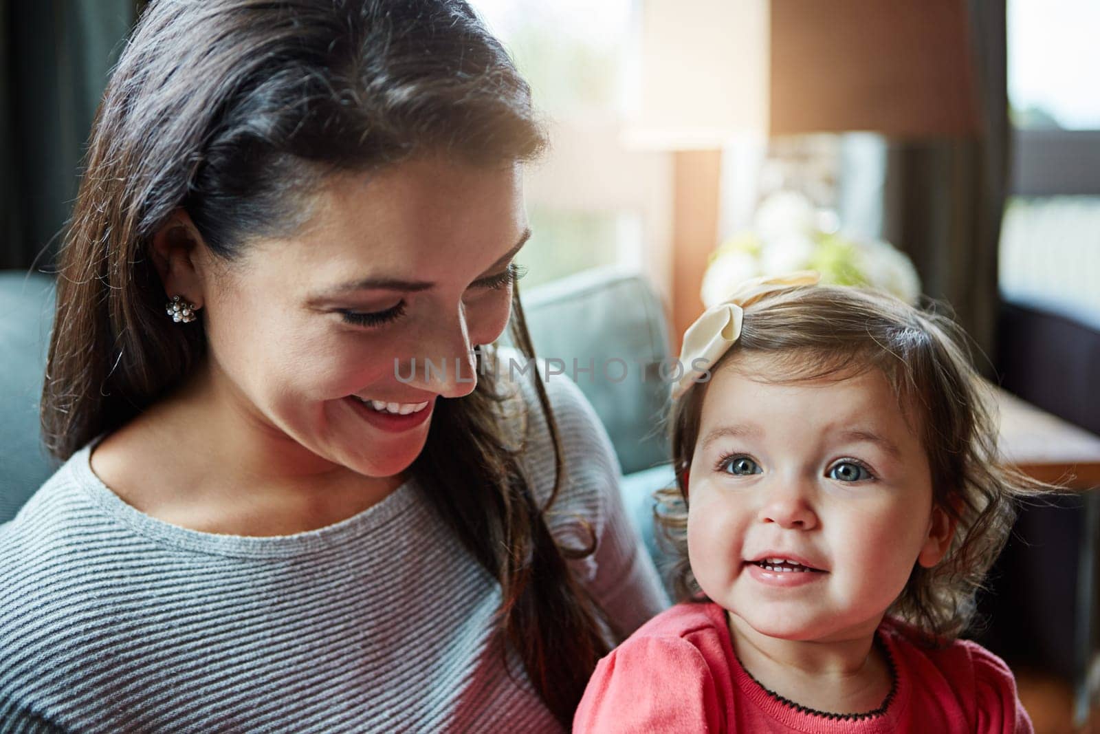 Relax, happy and smile with mother and baby on sofa for bonding, quality time and child development. Growth, support and trust with mom and daughter in family home for health, connection and care.