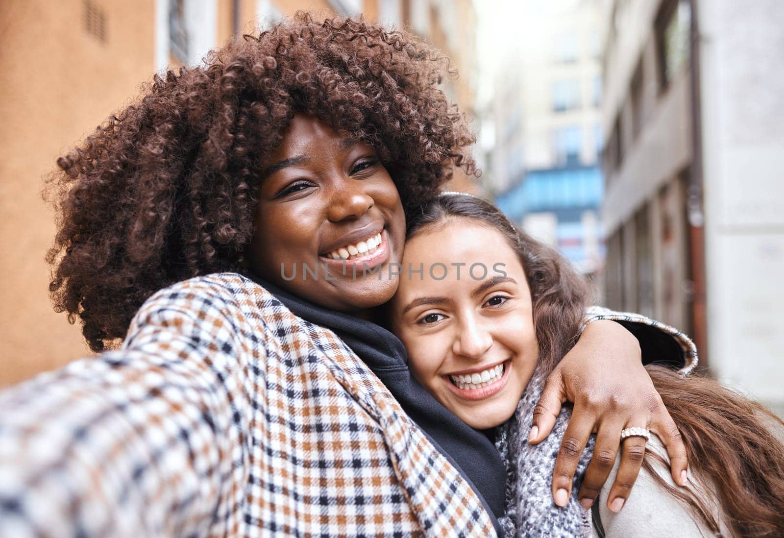 Friendship, happy and portrait of women on a holiday together walking in the city street in Italy. Happiness, smile and interracial female gay couple hugging in the road in town while on a vacation